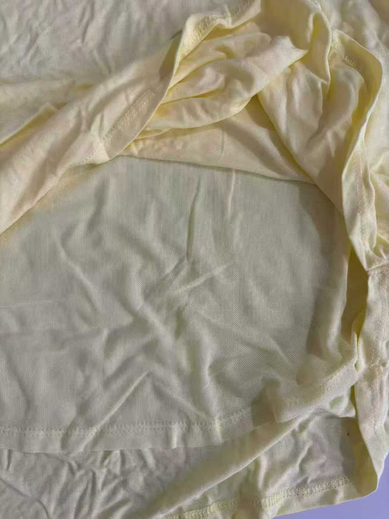 Round neckline view of light yellow ladies' blouse