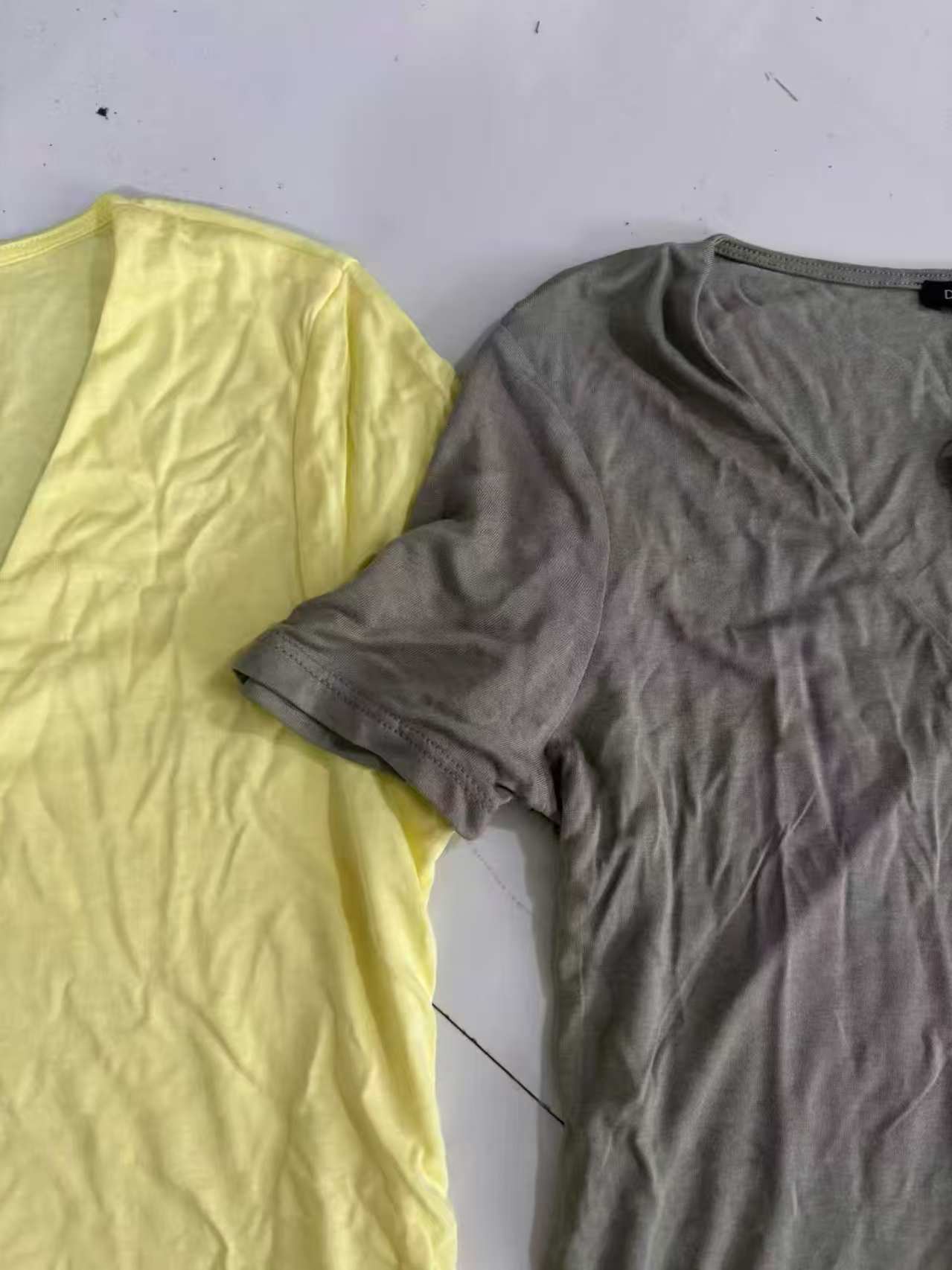 Yellow ladies' short sleeve blouse folded showing front design