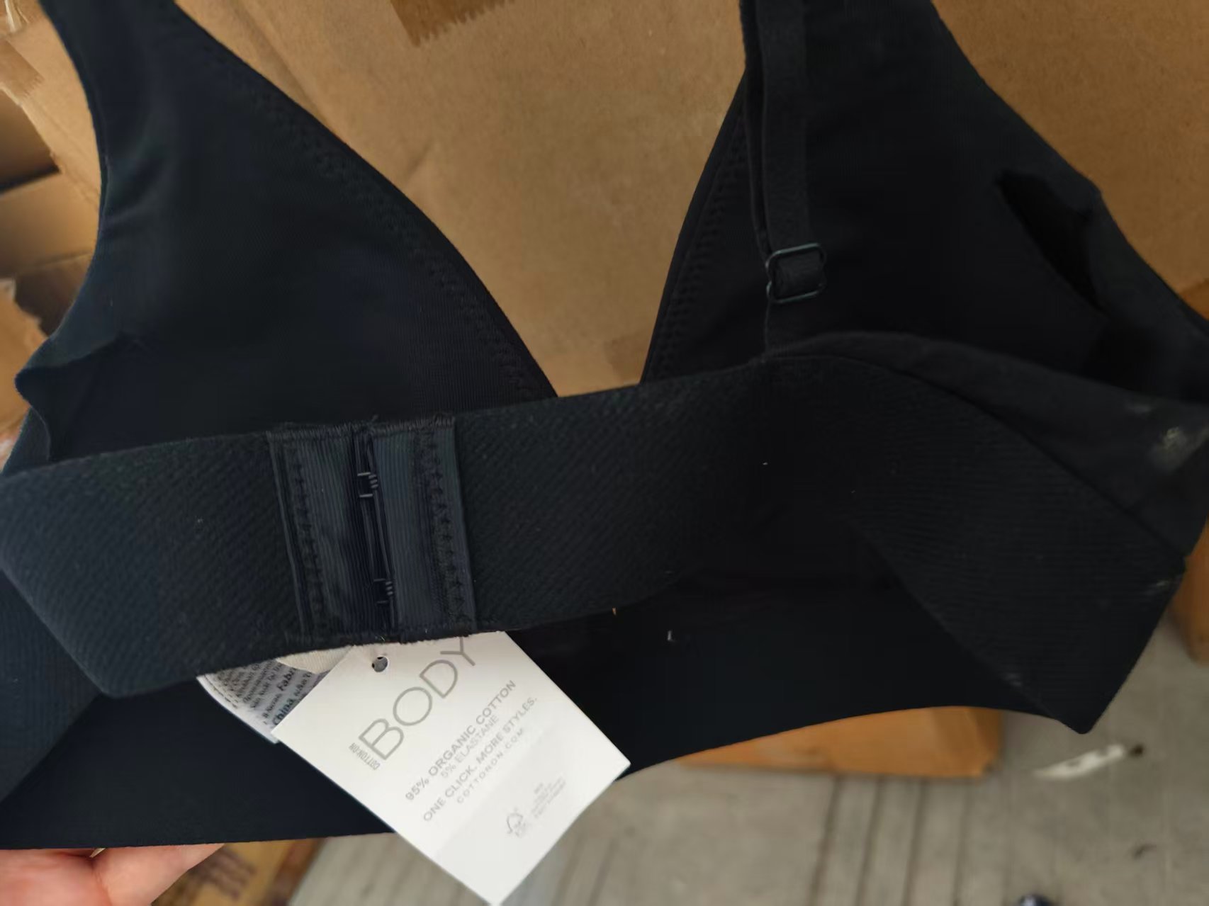 Close-up detail of black organic cotton ladies' bra cups and inner lining