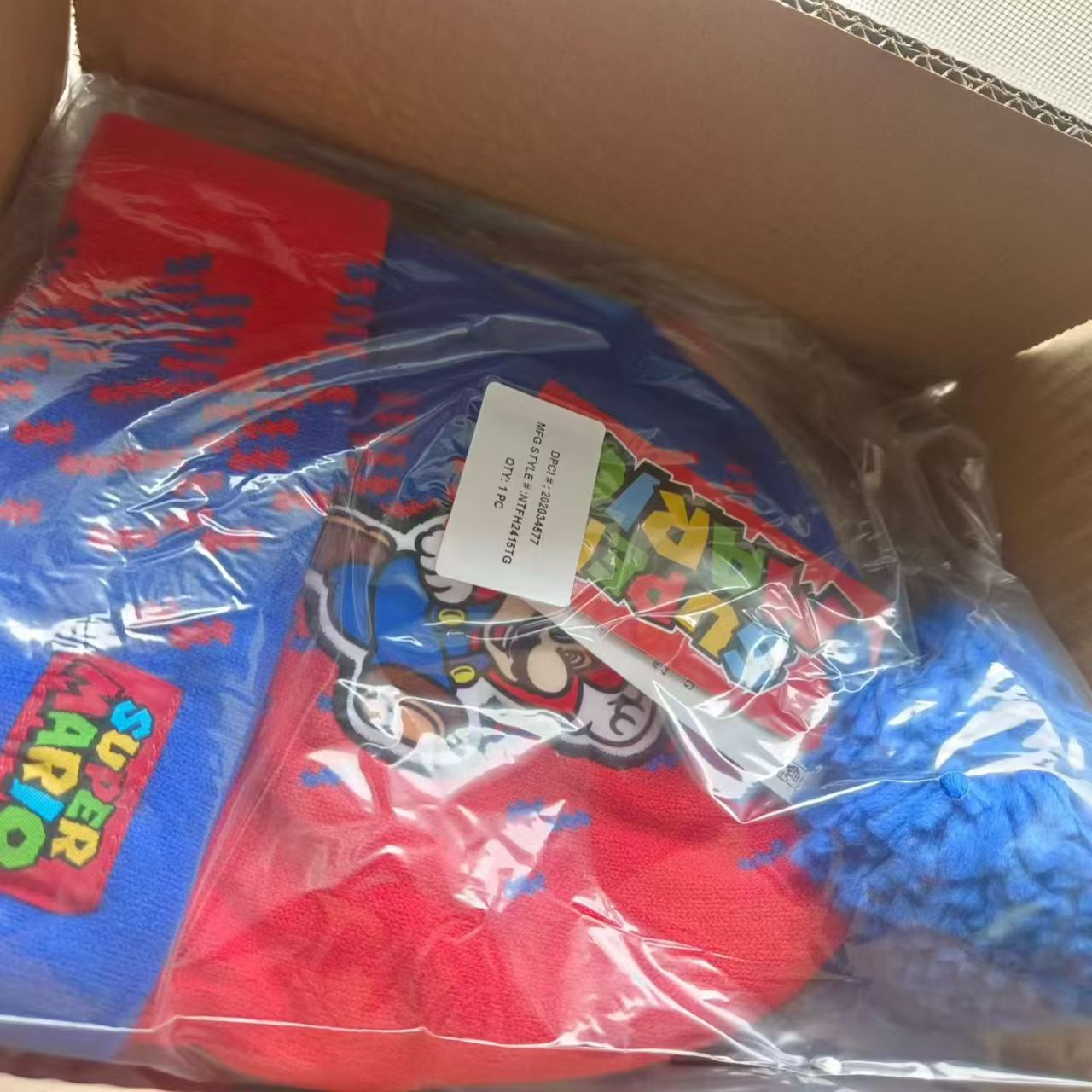Kids' character knit beanies individually packed in clear polybags in a shipping box