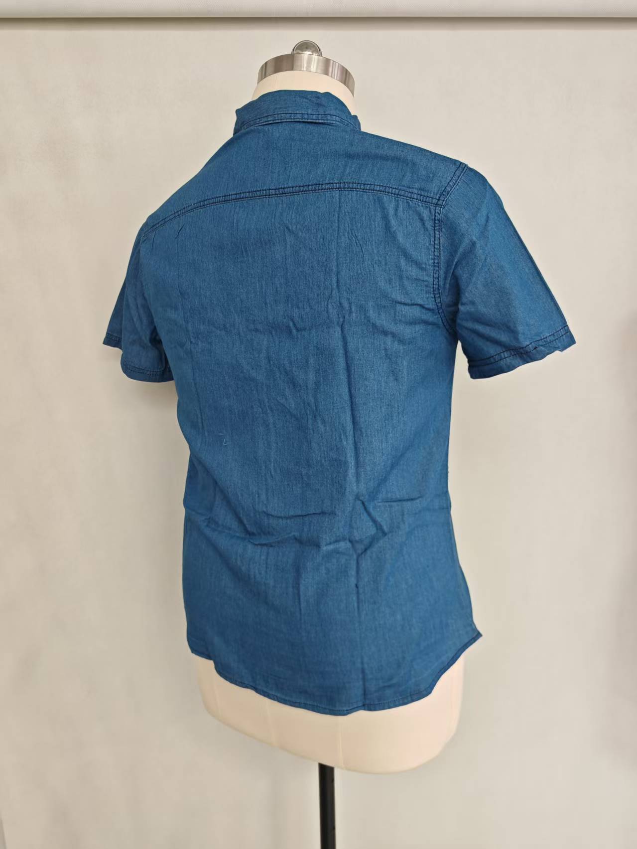 Blue men's short sleeve cotton shirt displayed on a mannequin