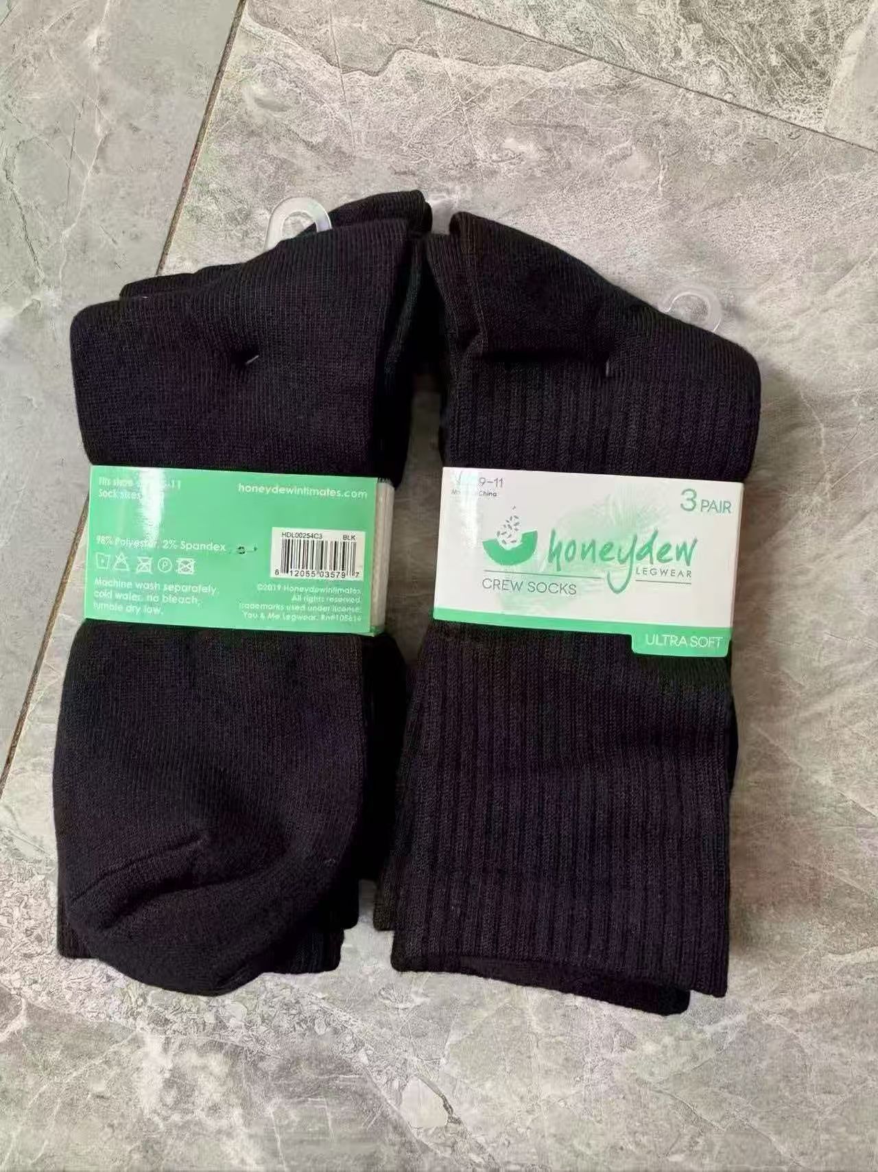 Pair of grey ladies' low cut ankle socks displayed flat