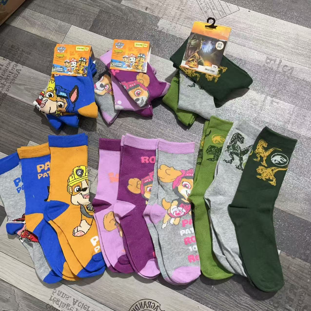 Colorful kids' cotton socks displayed together in multiple color combinations flat