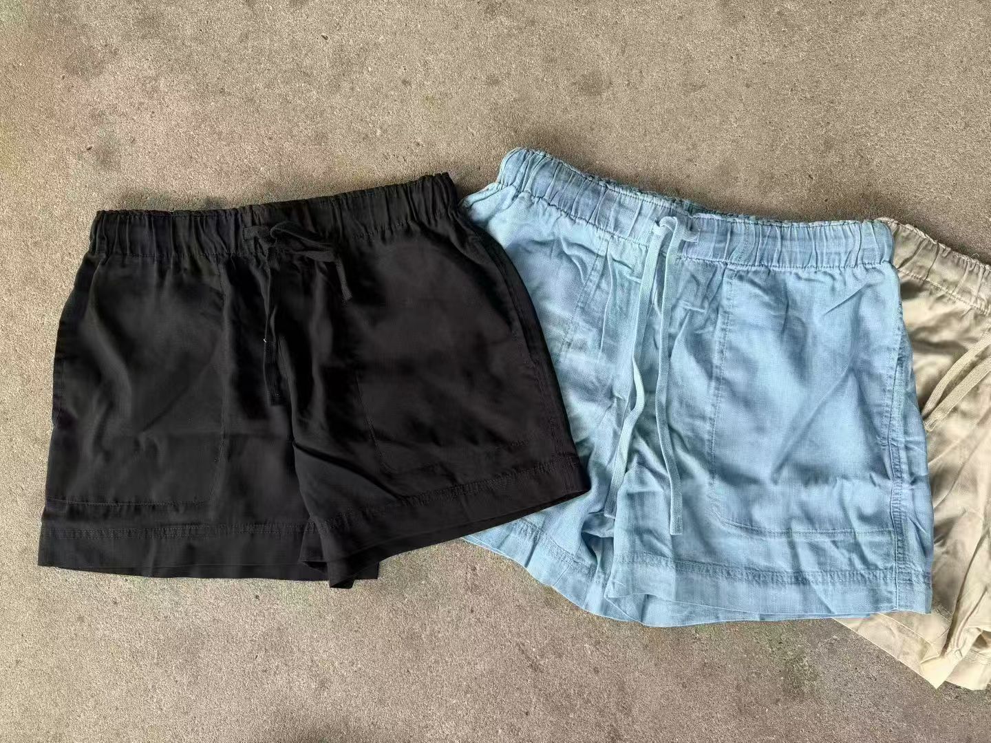 Close-up of the black women's Tencel shorts highlighting fabric texture and drawstring waist design.