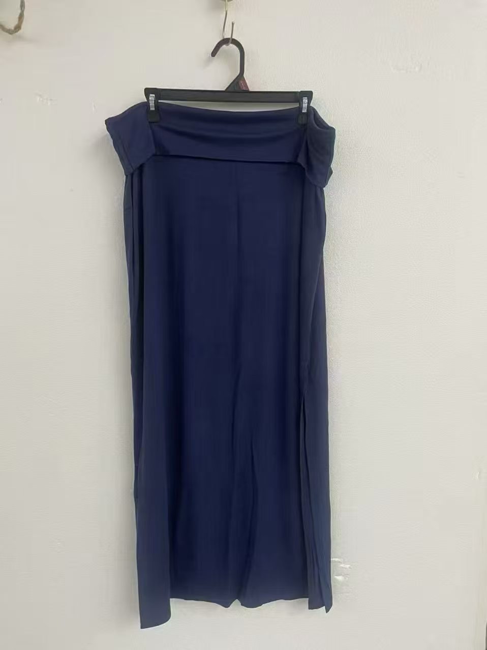 Dark blue women's long midi skirt displayed on a torso mannequin.