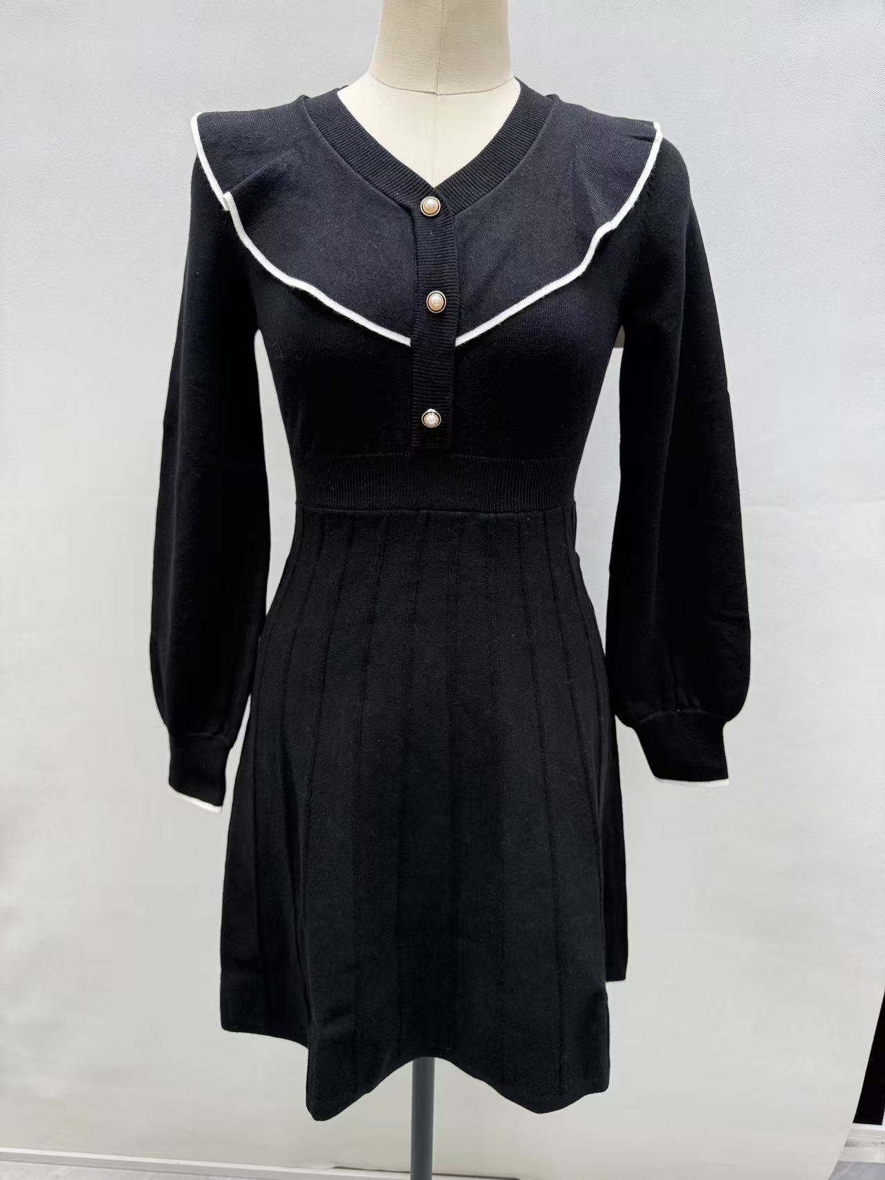 Women's black long-sleeve midi dress with white sailor collar trim, displayed on a torso mannequin.