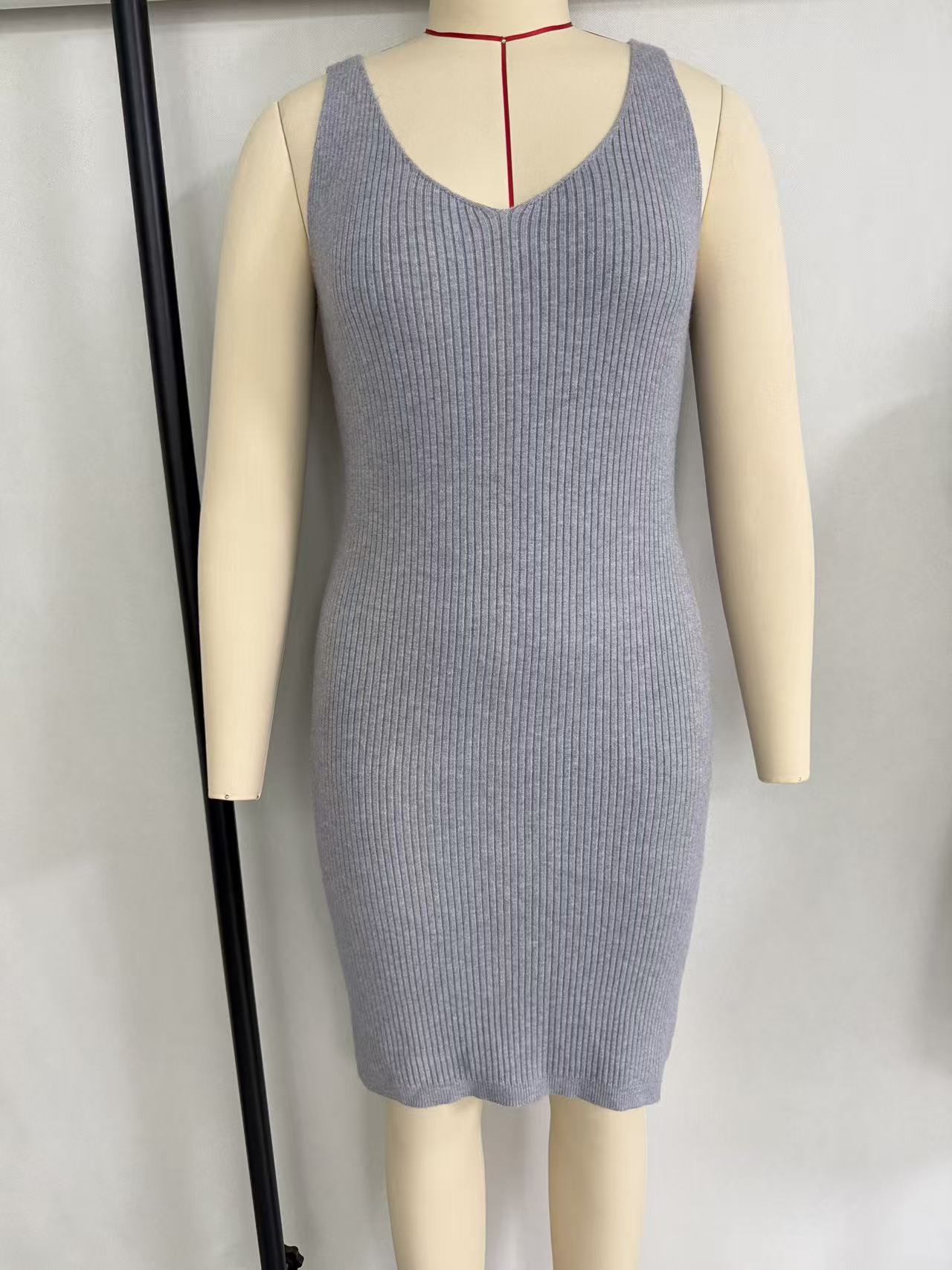 Women's ribbed knit short-sleeve midi dress with crew neck, displayed on a torso mannequin.