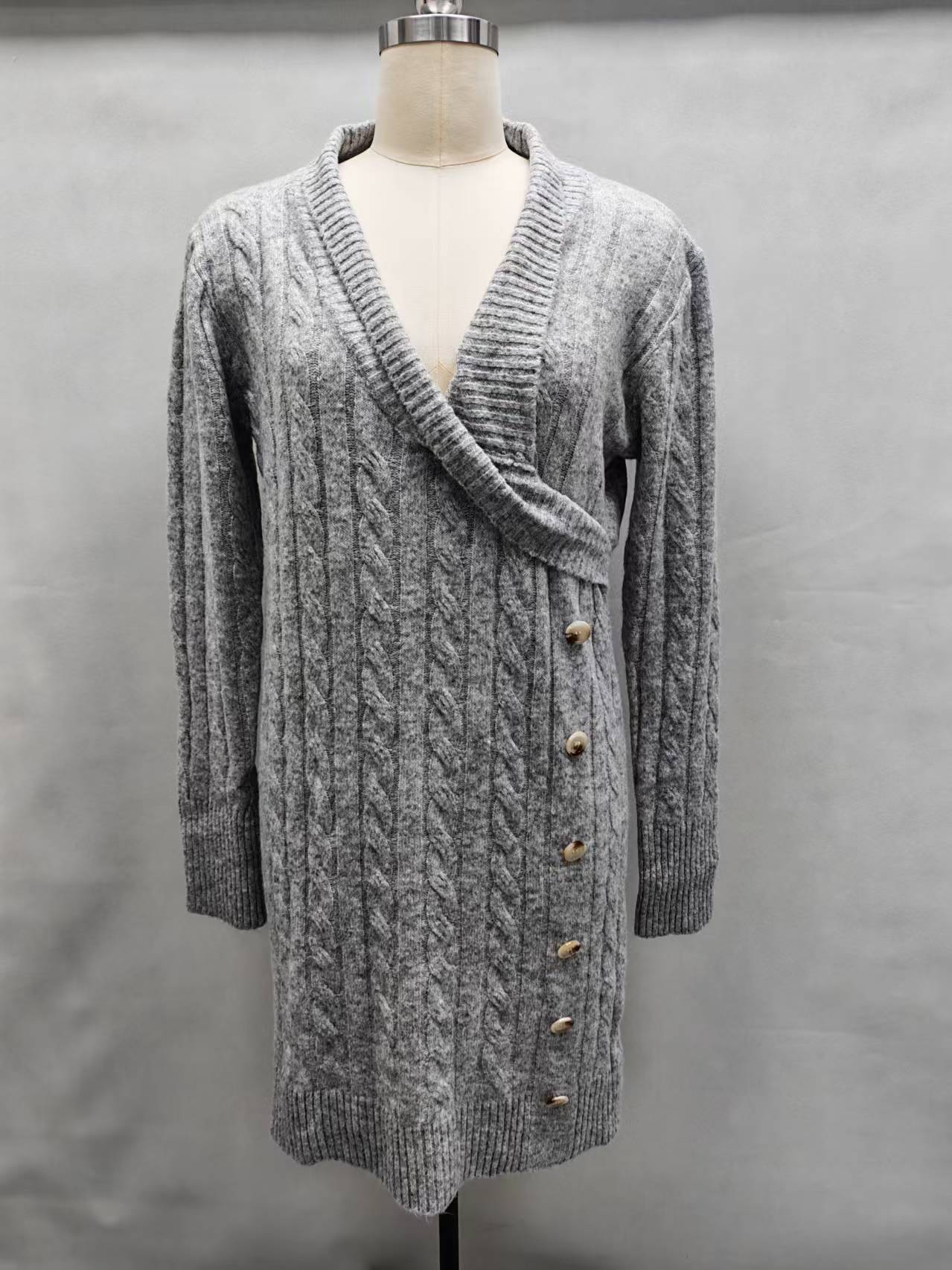 Black women's open-front cardigan sweater displayed on a torso mannequin.