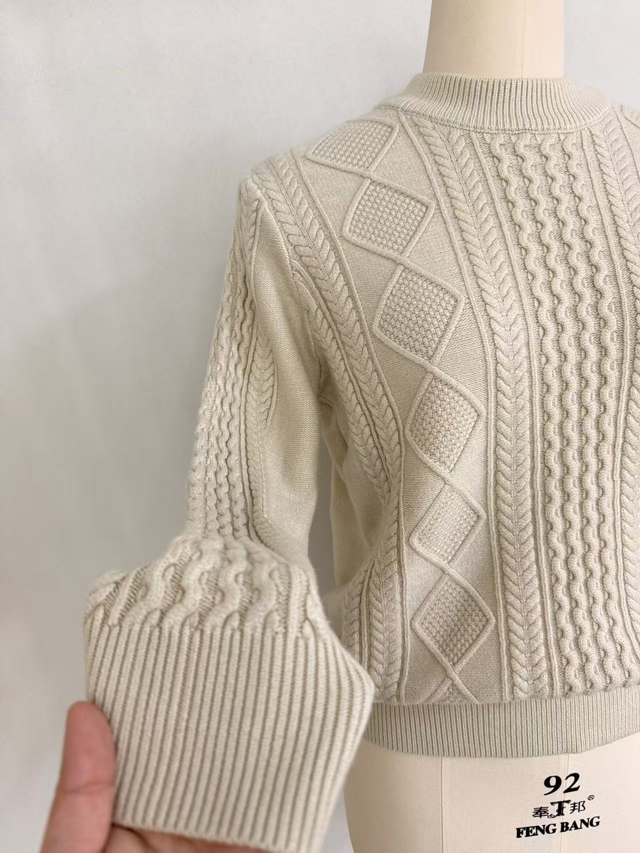 Side view and sleeve detail of ladies' camel sweater TF8598