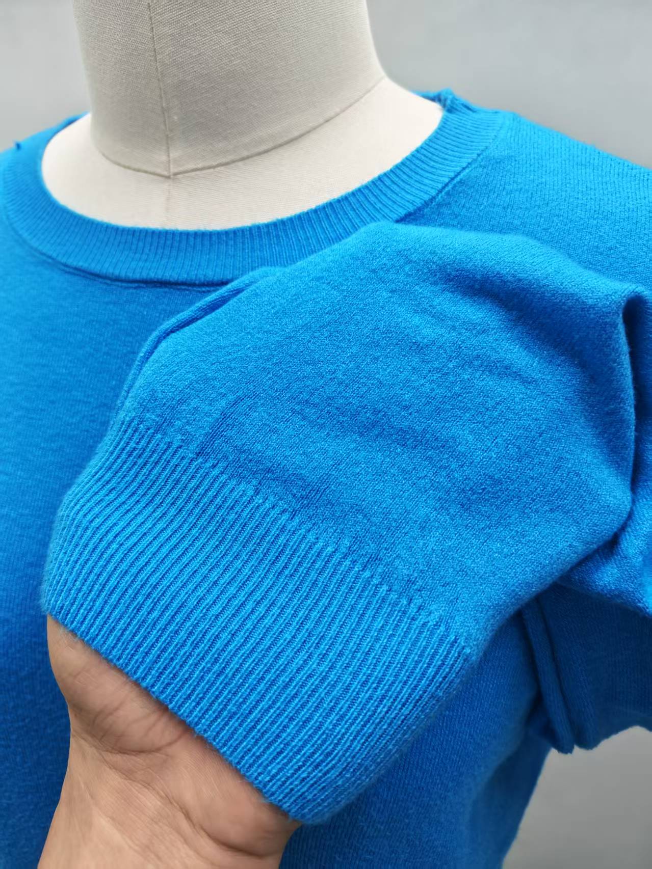 Neckline detail of women's blue knit sweater TF8639