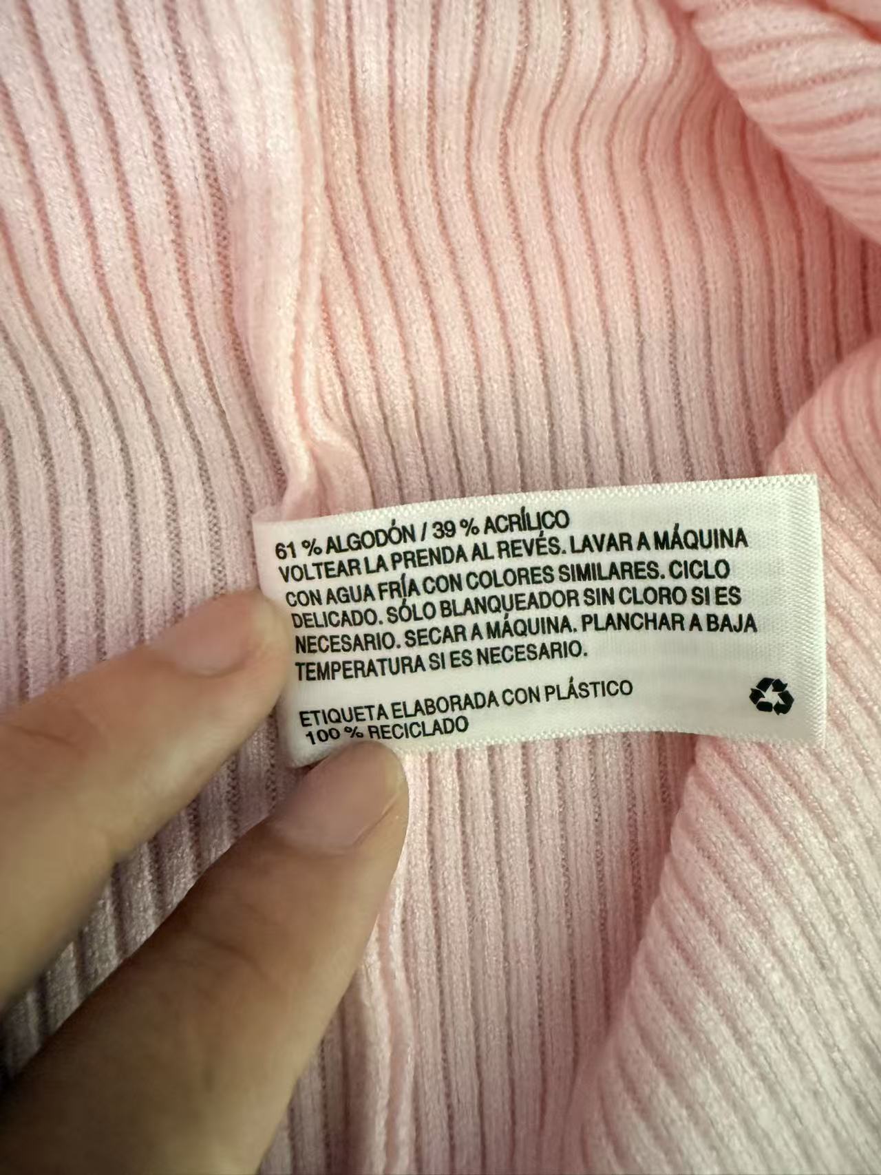 Care label and fabric close-up of ladies' knit sweater TF8668