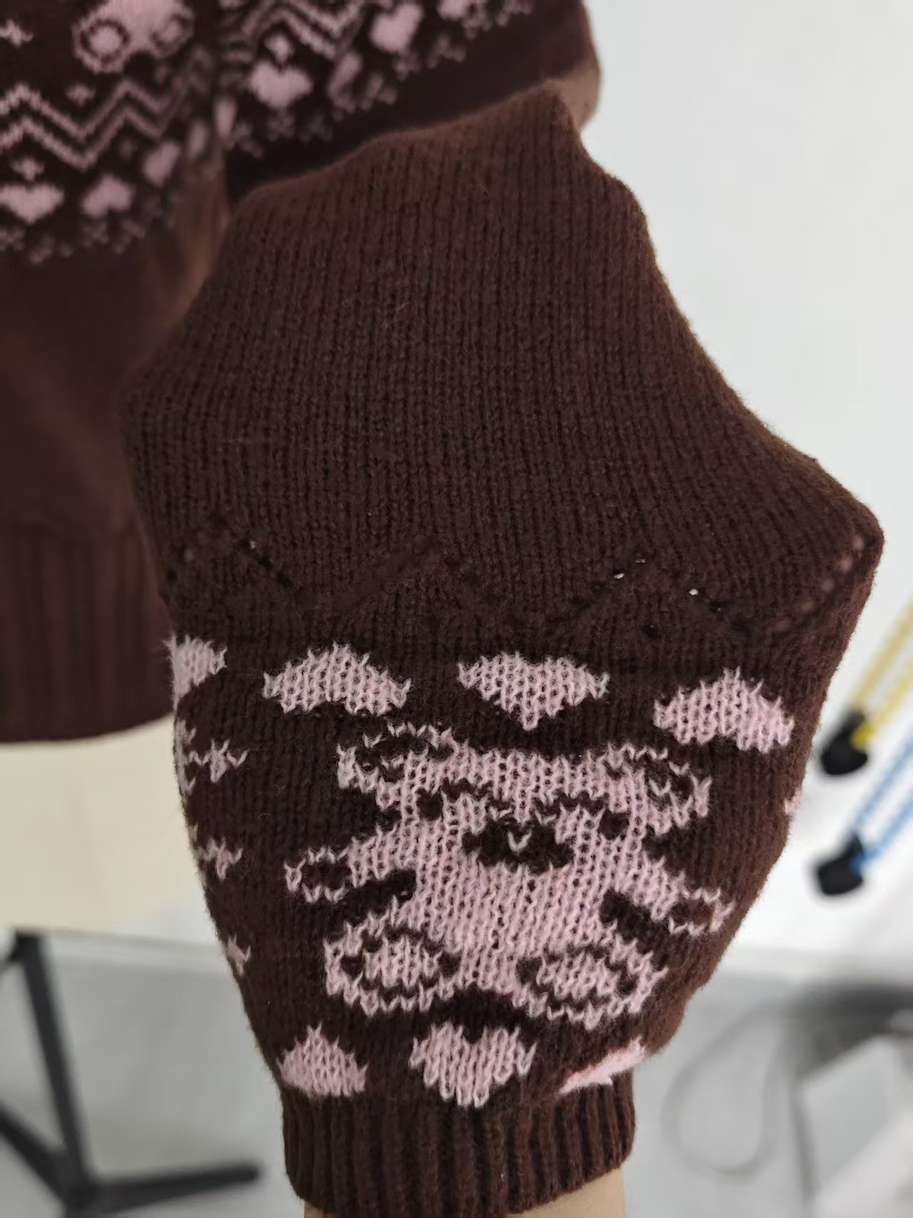 Neckline and pattern close-up of women's knit sweater TF8703