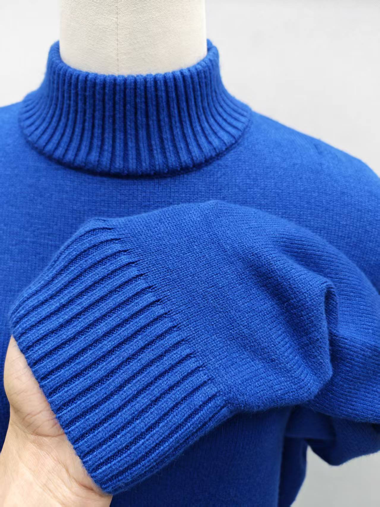 Close-up turtleneck collar of royal blue knit sweater TF8716