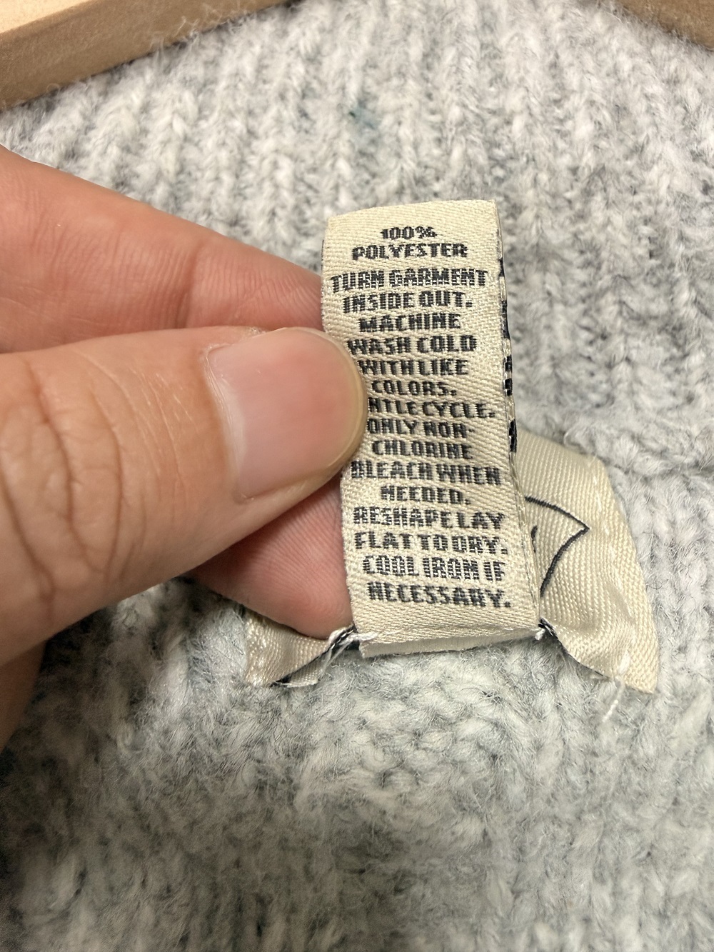 Care label and fabric detail of ladies' sweater TF8740