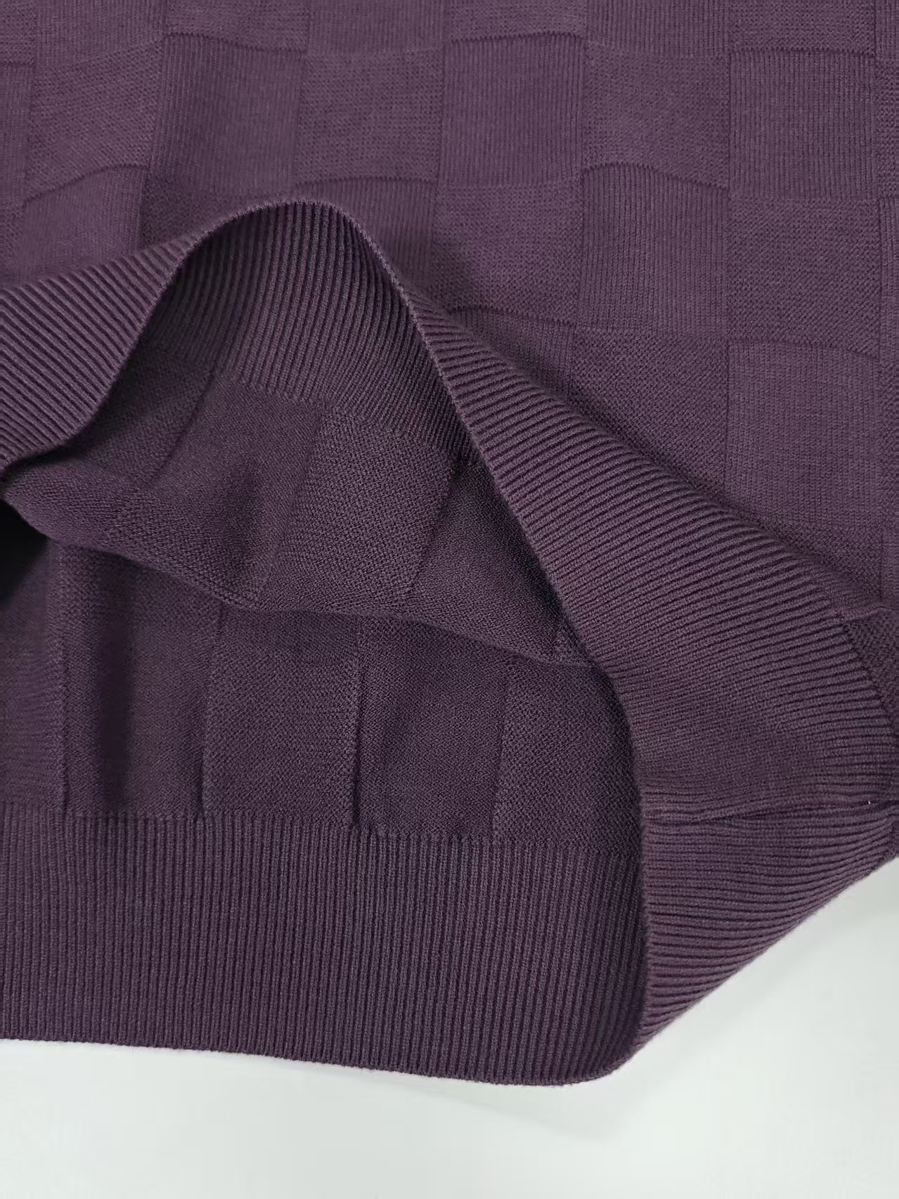 Fabric texture close-up of men's checkered knit sweater TF8809