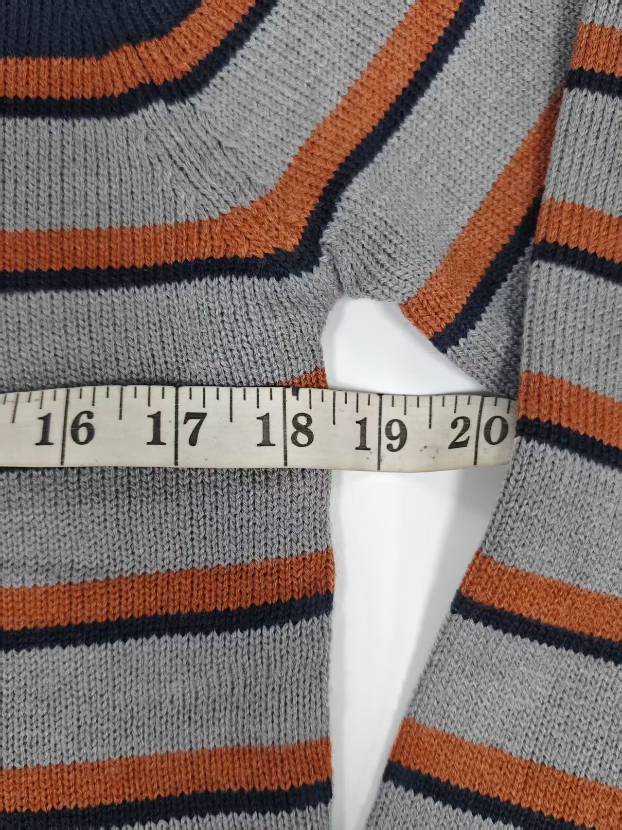 Close up measurement shot of men's striped knit sweater TF8826 fabric and stripe detail