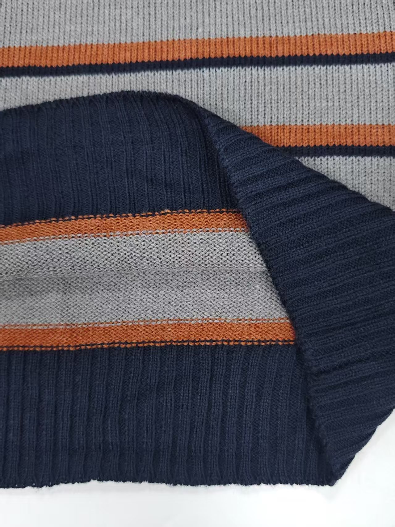 Close up hem stripe detail of men striped knit sweater TF8826