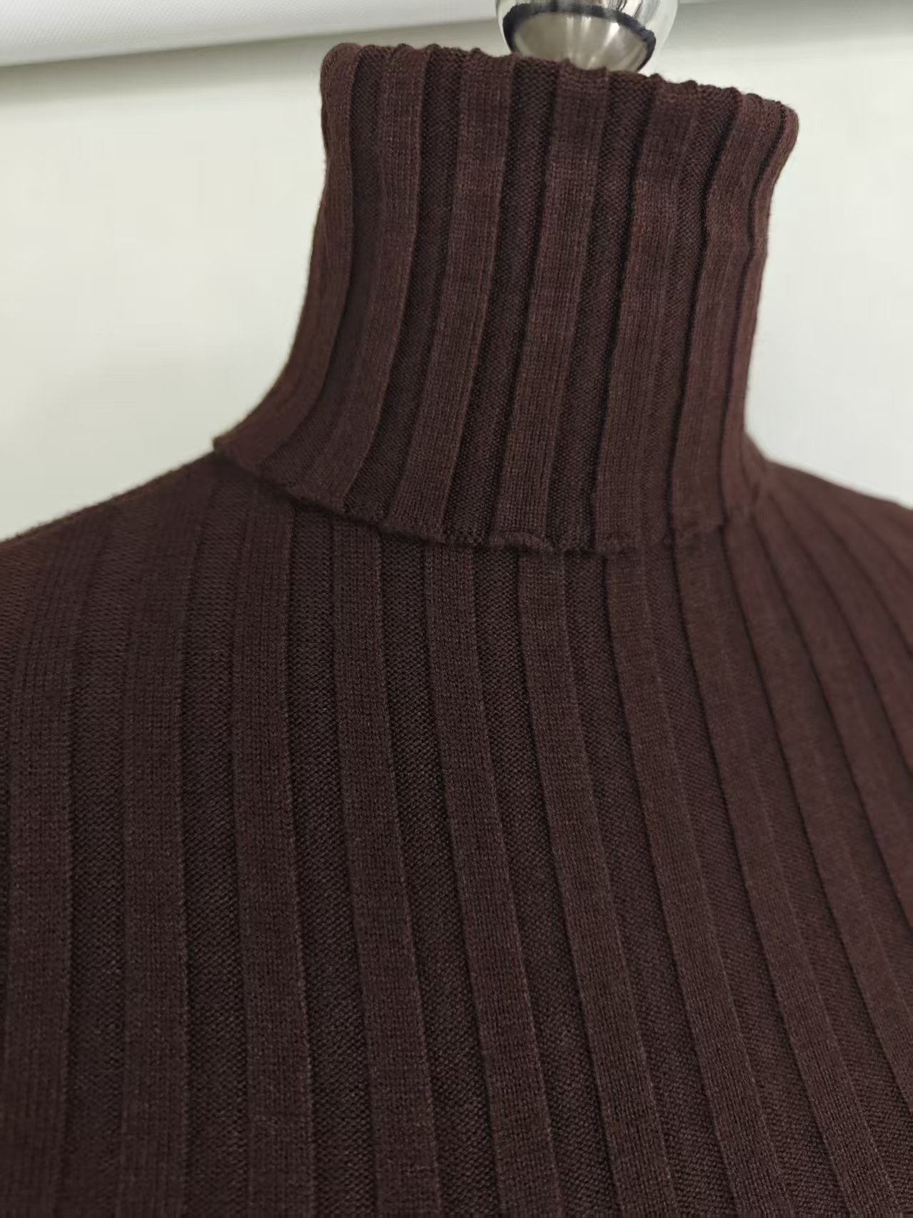 Close up view of ribbed turtleneck collar on women knit sweater TF8829