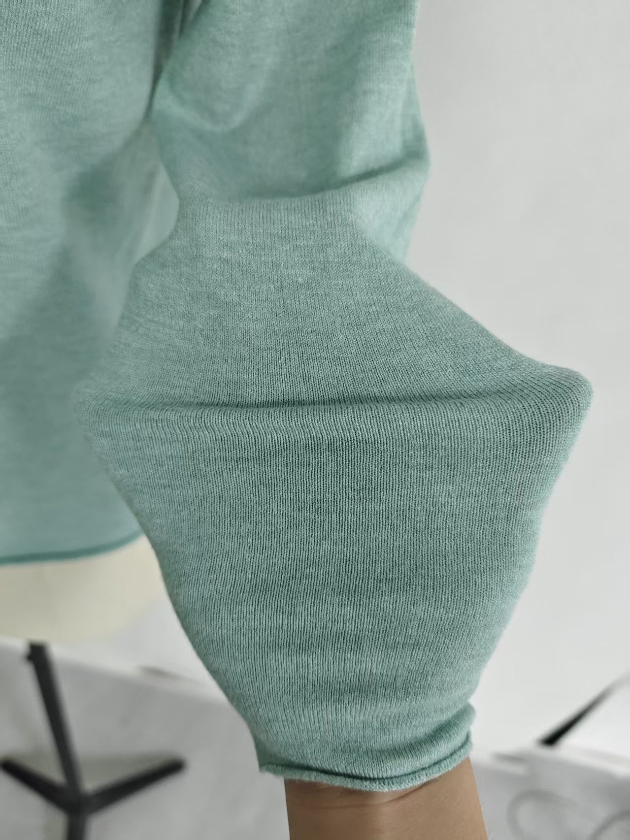 Close up fabric detail shot of ladies light green V-neck sweater TF8822