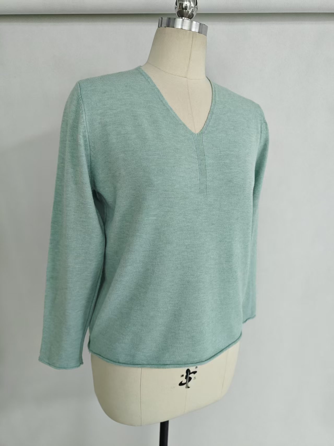 Light green women V-neck long sleeve knit top TF8822 front on dress form