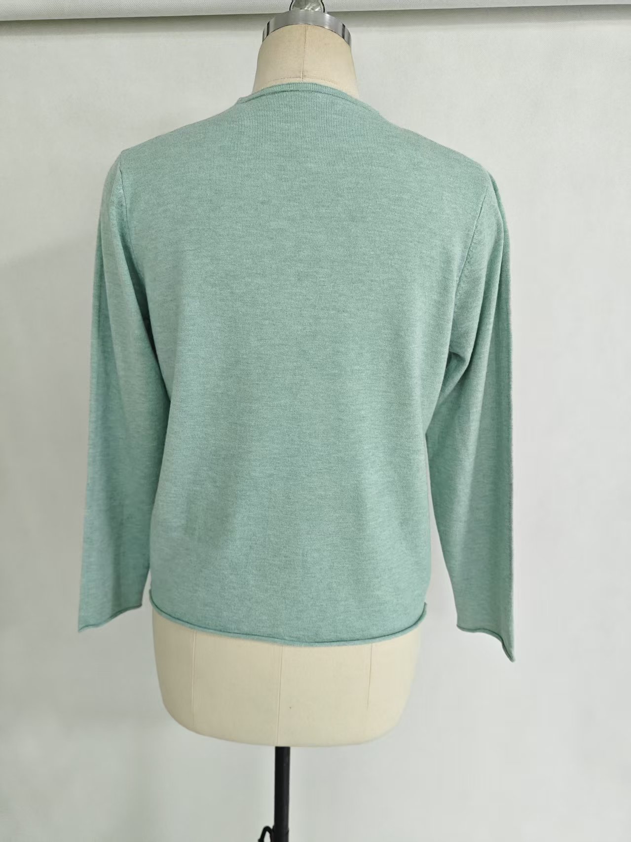 Wholesale women light green V neck knit sweater TF8822 back view on mannequin