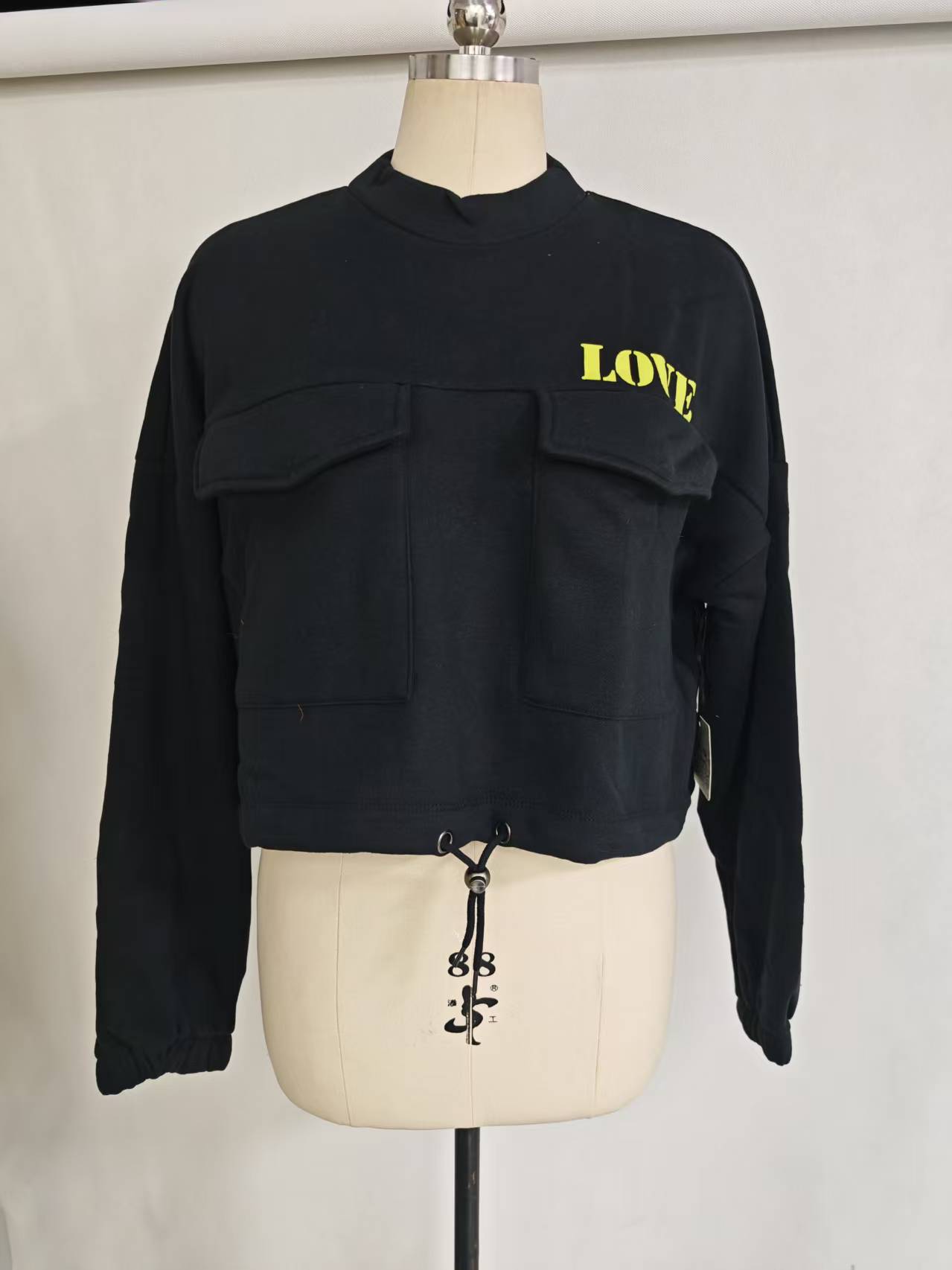 Wholesale ladies black cropped sweatshirt TF8851 front view on mannequin