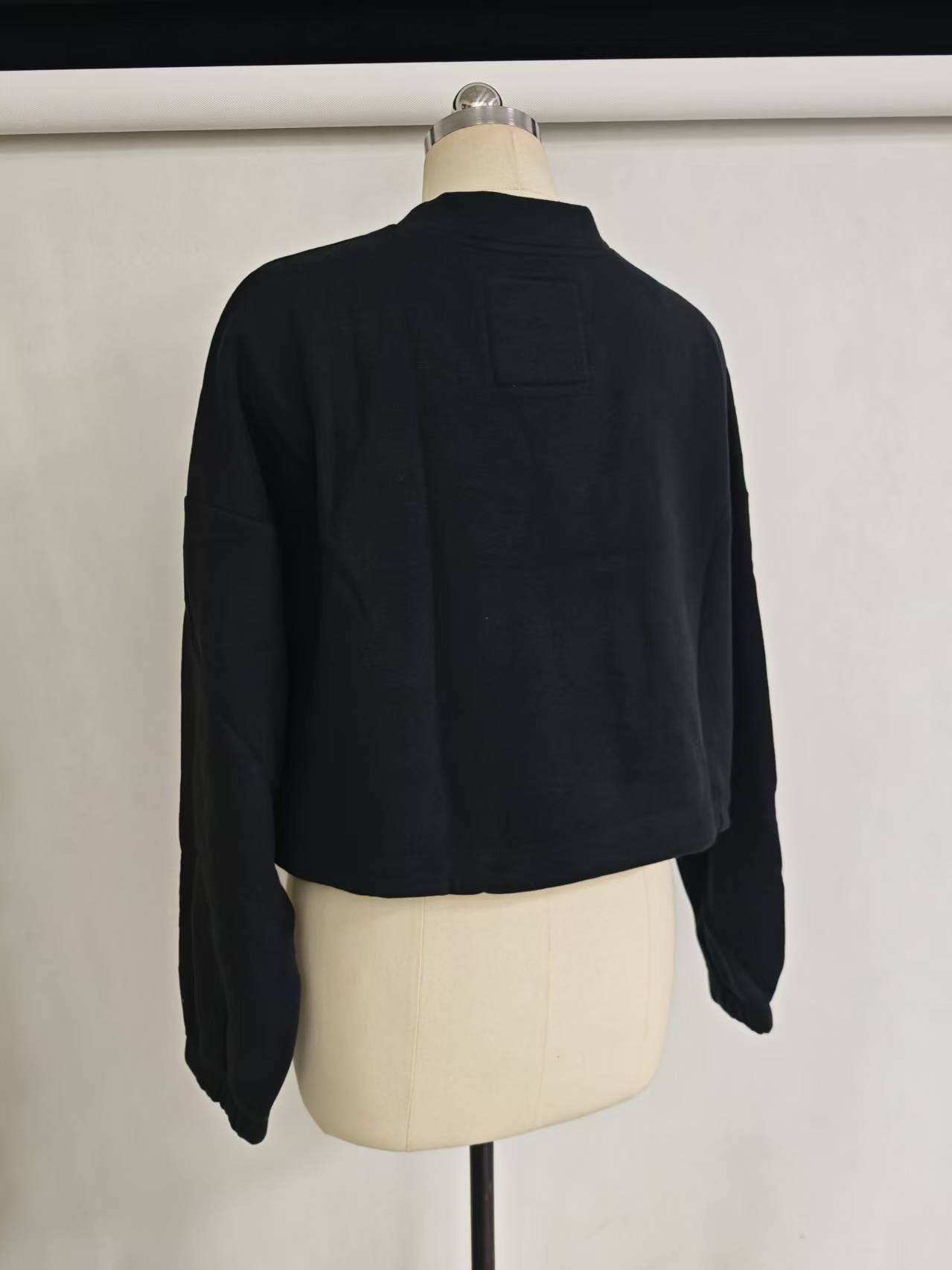 Wholesale women black cropped sweatshirt TF8851 back view on dress form