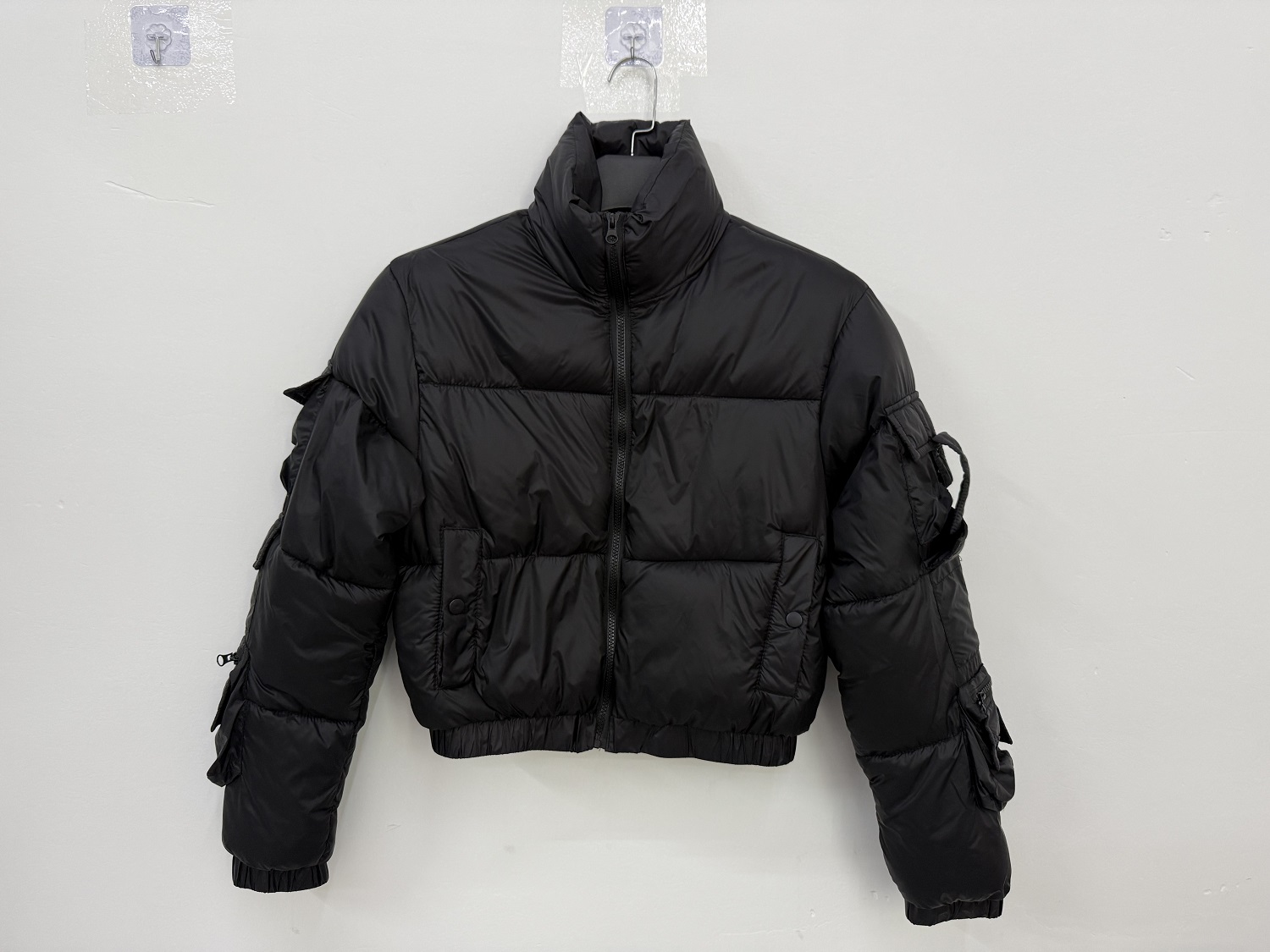 Wholesale ladies black cropped puffer jacket TF8905 hanging front view