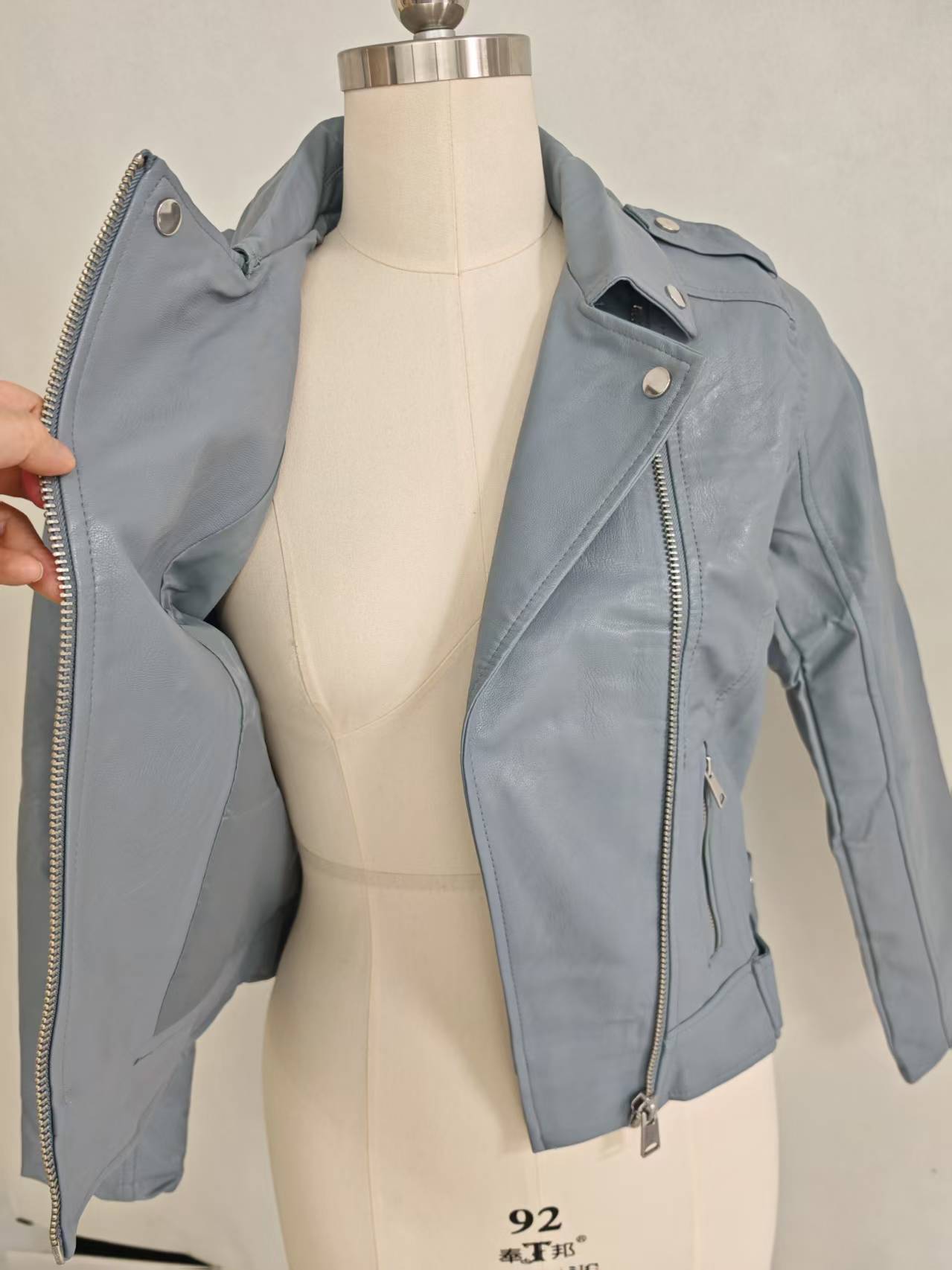 Ladies light blue biker jacket open front view on dress form TF8887