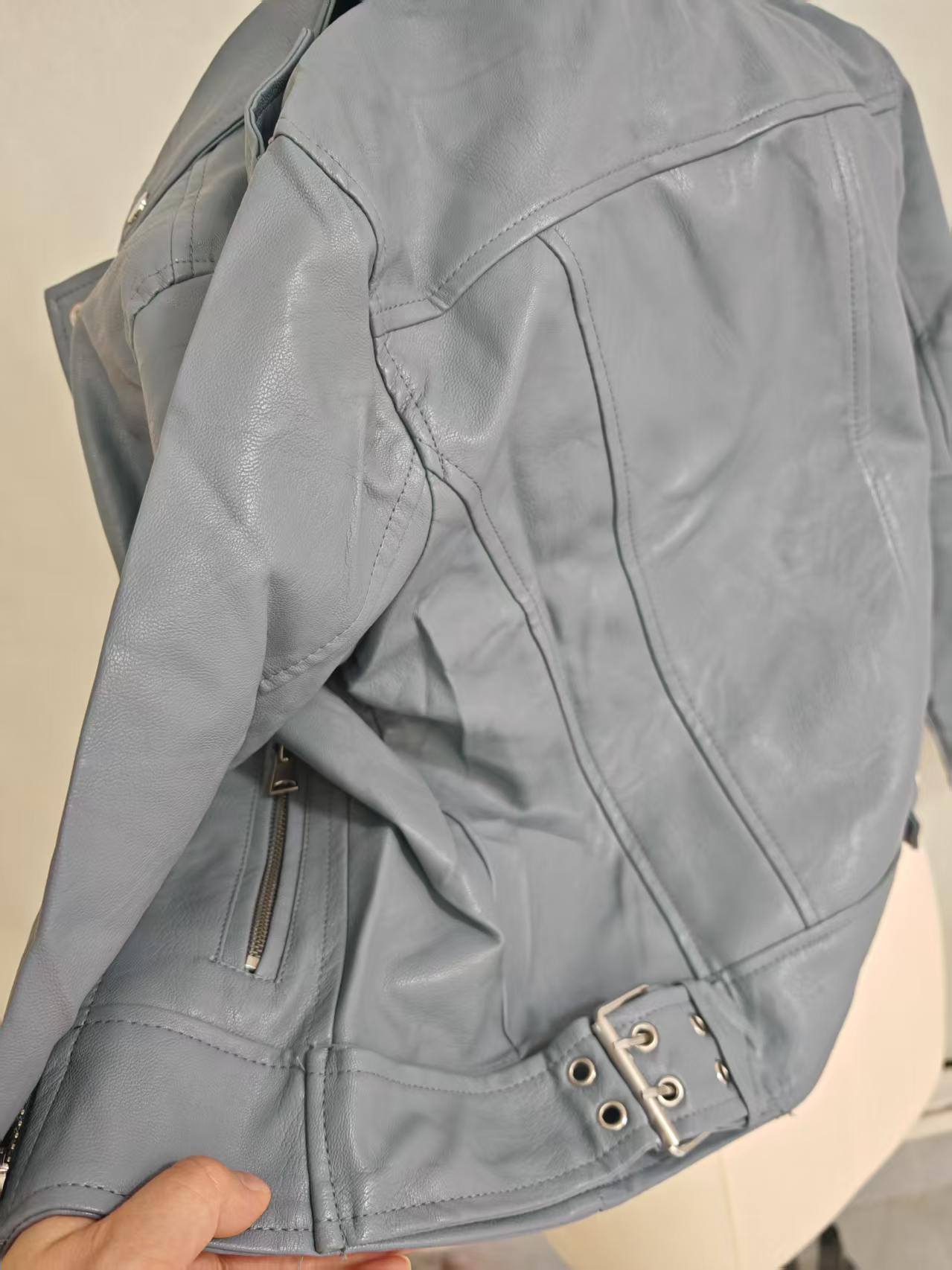 Ladies blue biker jacket side buckle and zipper detail TF8887 close-up