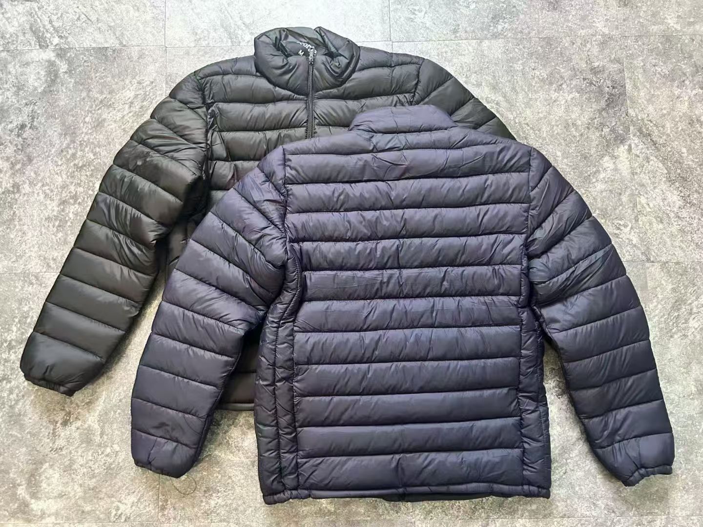 Front view of men's navy blue lightweight puffer jacket TF9000