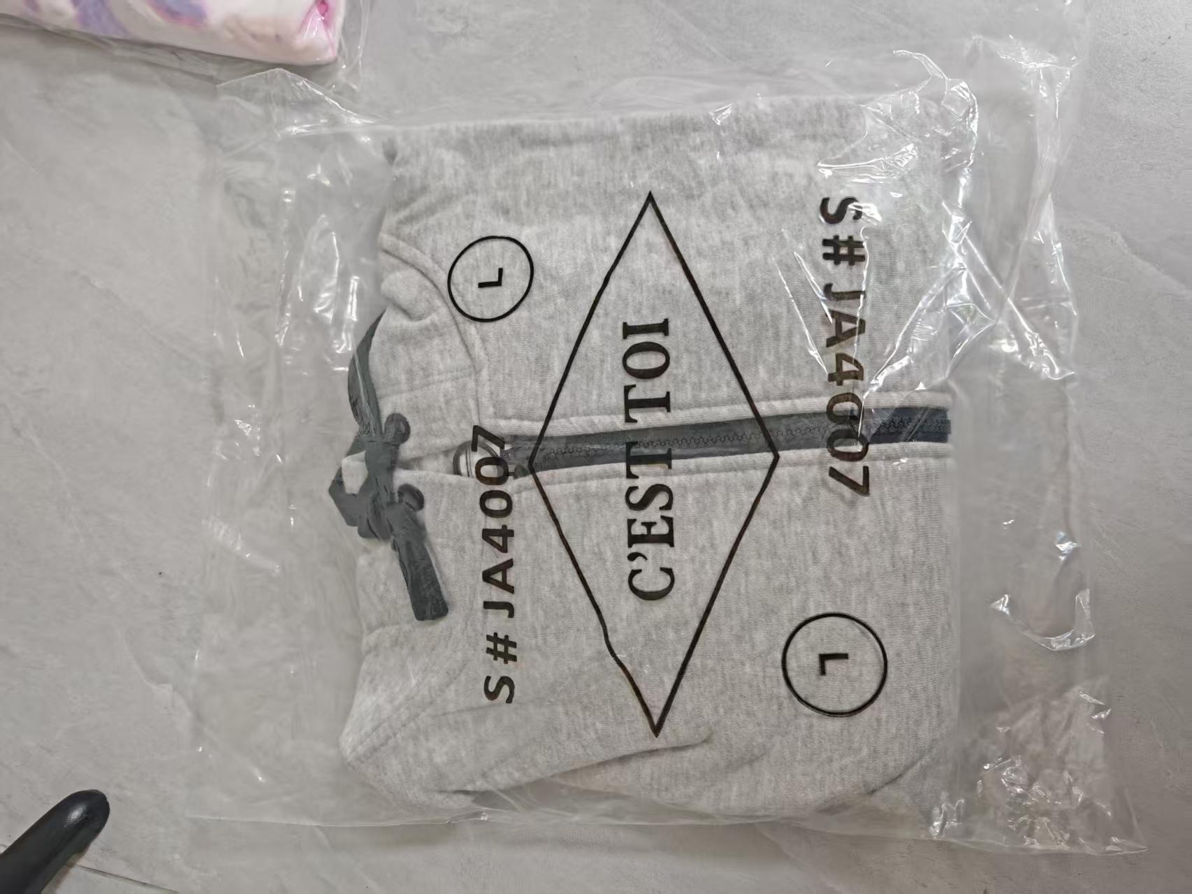 Ladies cropped hoodie packed in clear polybag with size tag TF8854