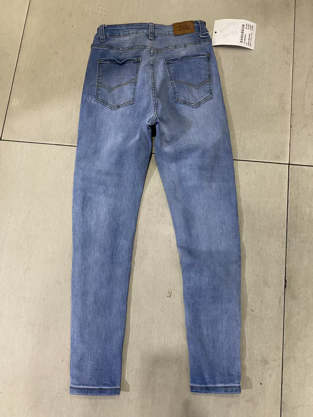 Front view of ladies light blue cotton blend jeans TF8929