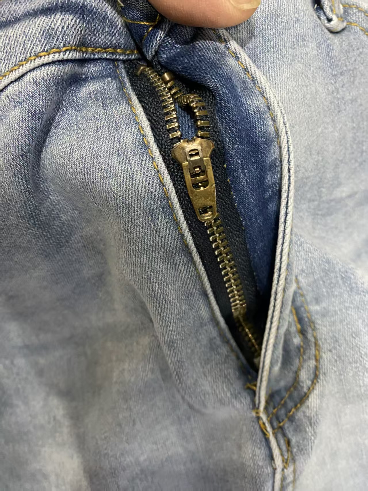 Close up of waistband button and zipper closure style TF8929