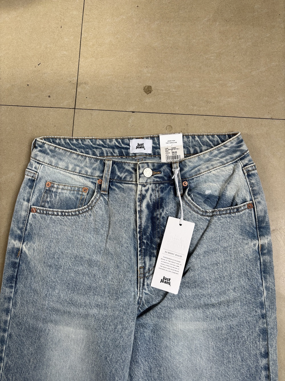 Flat lay view of ladies sky blue denim jeans TF8697 bulk wholesale