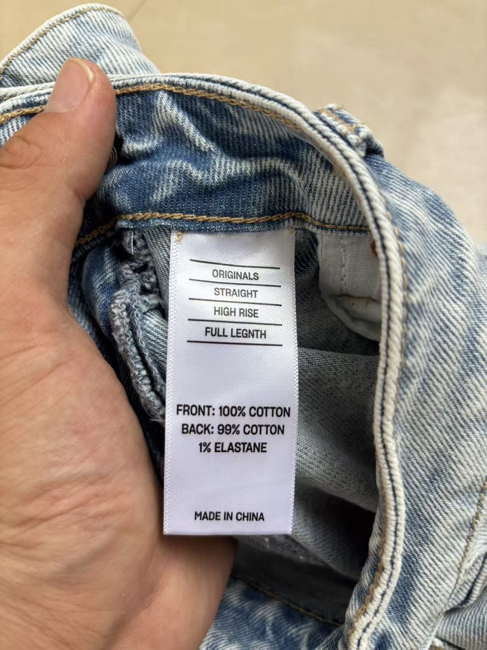Care label and inner waistband of ladies cotton jeans TF8697