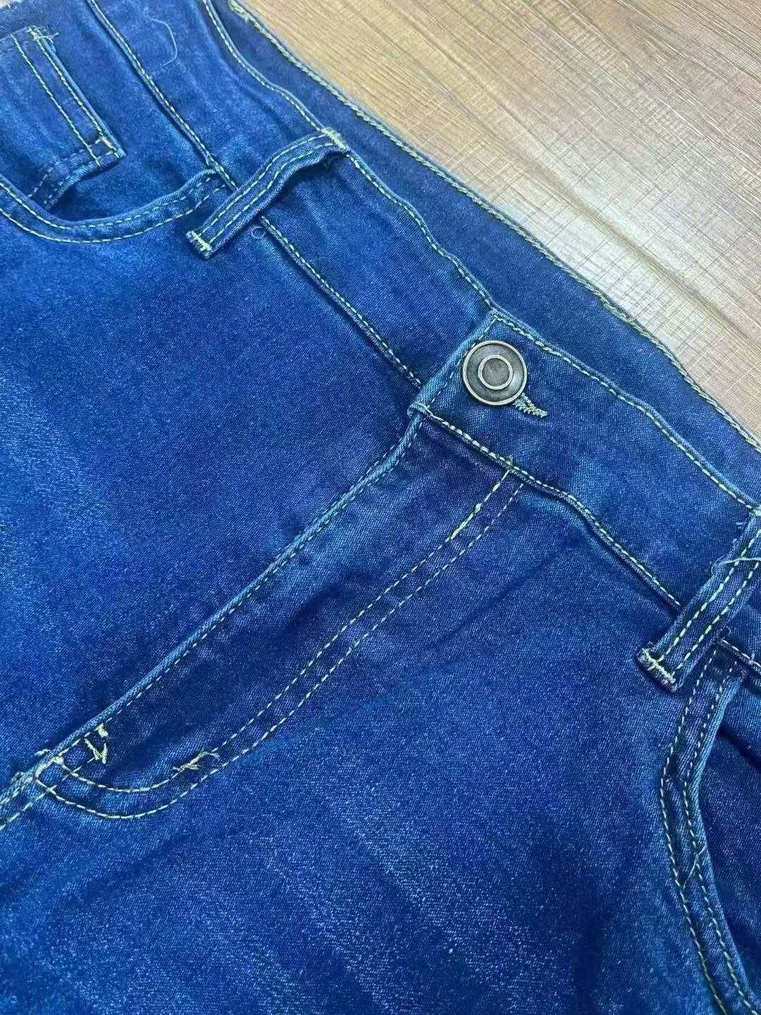 Close up of men's dark blue denim fabric style TF8650