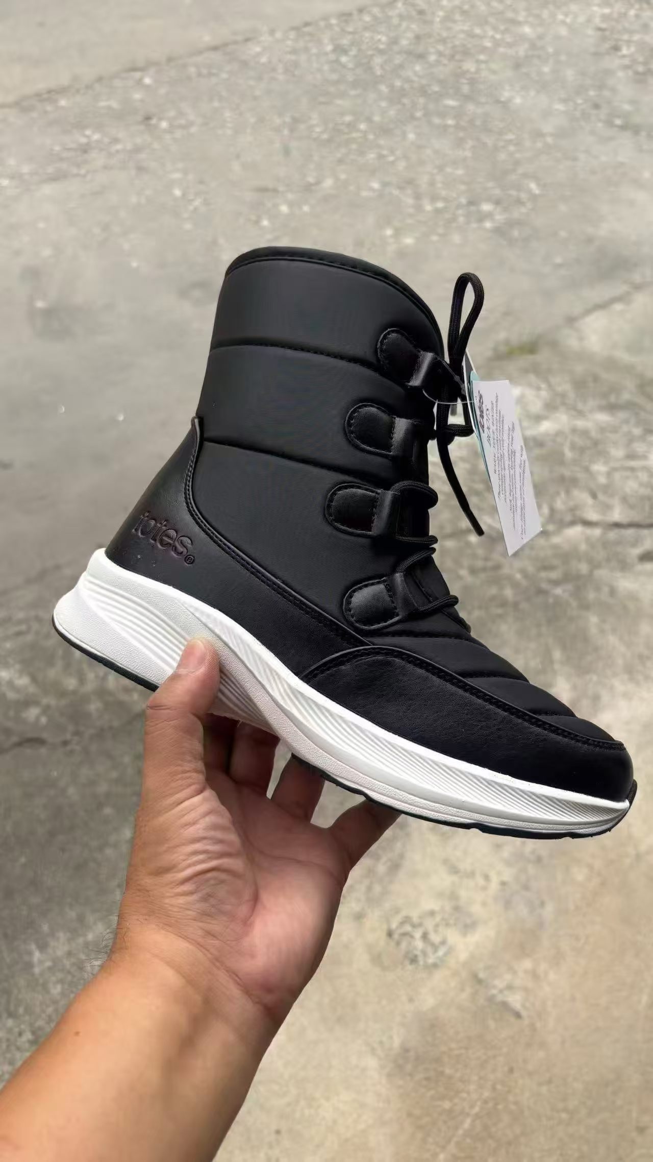 Side view of women's black ankle boots on foot style TF8953