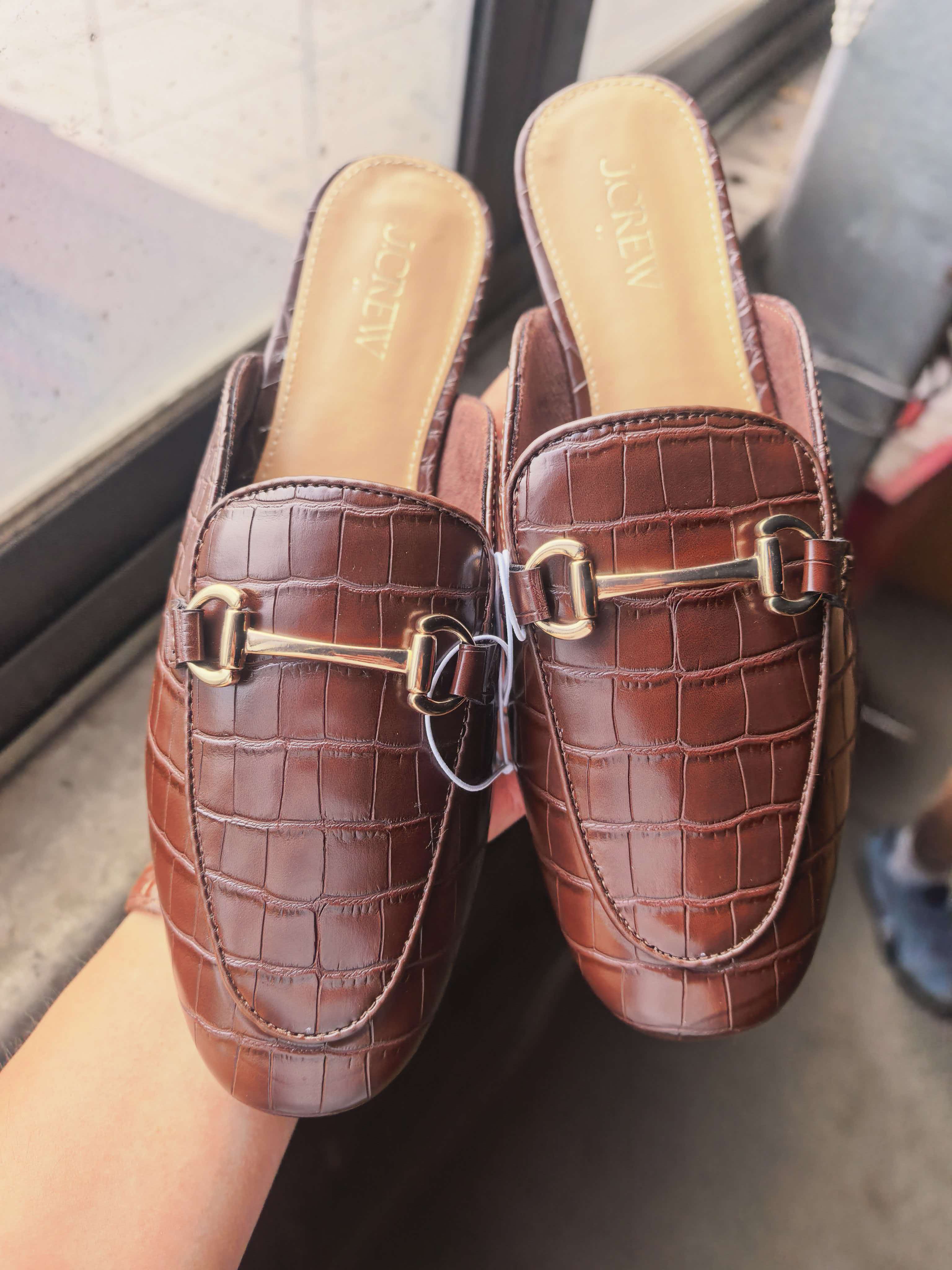 Wholesale ladies brown crocodile print mule slippers TF8893 held in hand front view