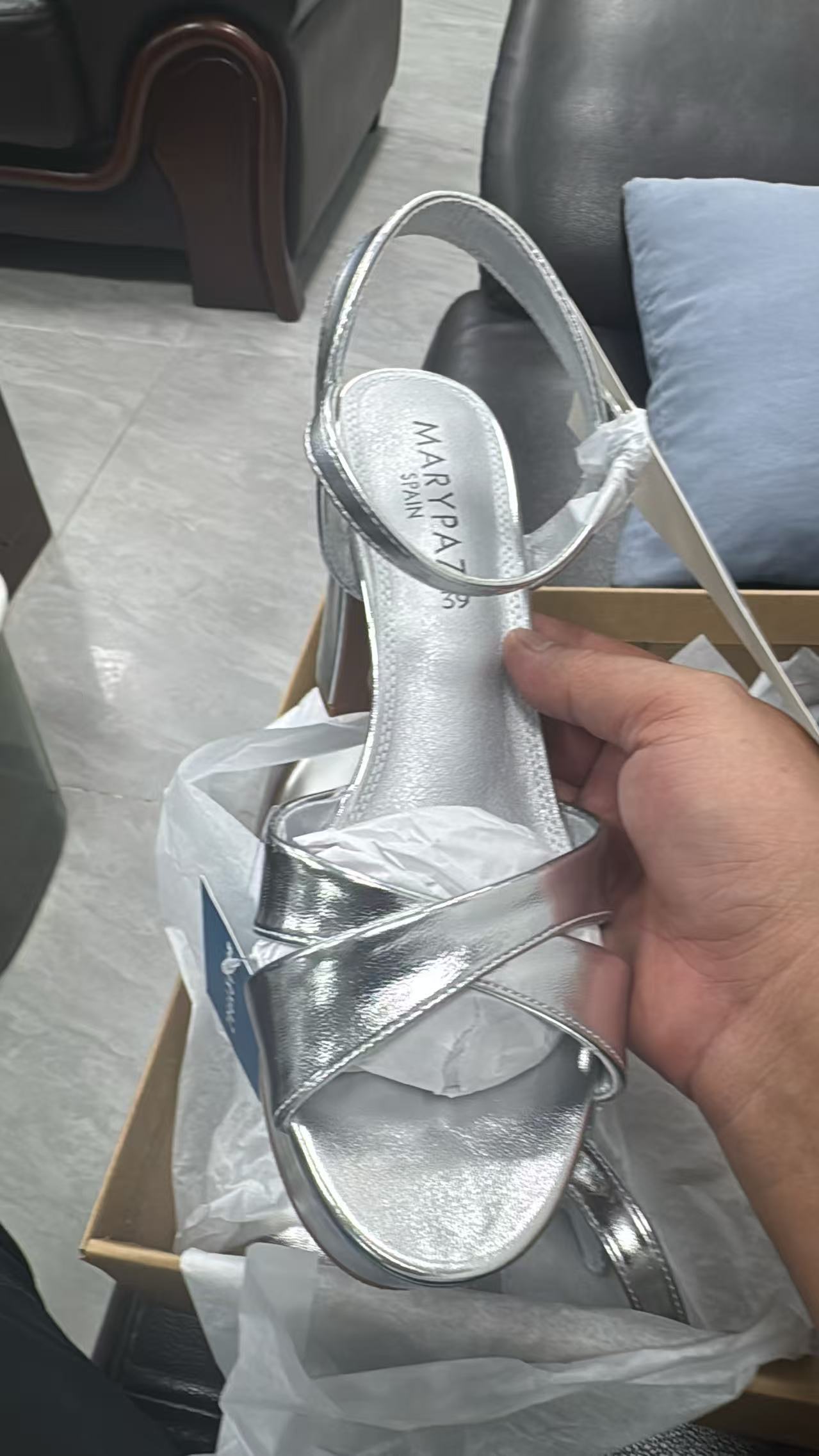 Close up of strap and heel details on ladies silver high heels TF8612