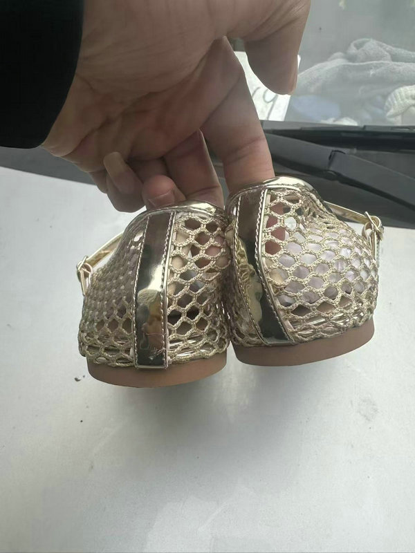 Close up view of ladies champagne gold flat shoes TF8736