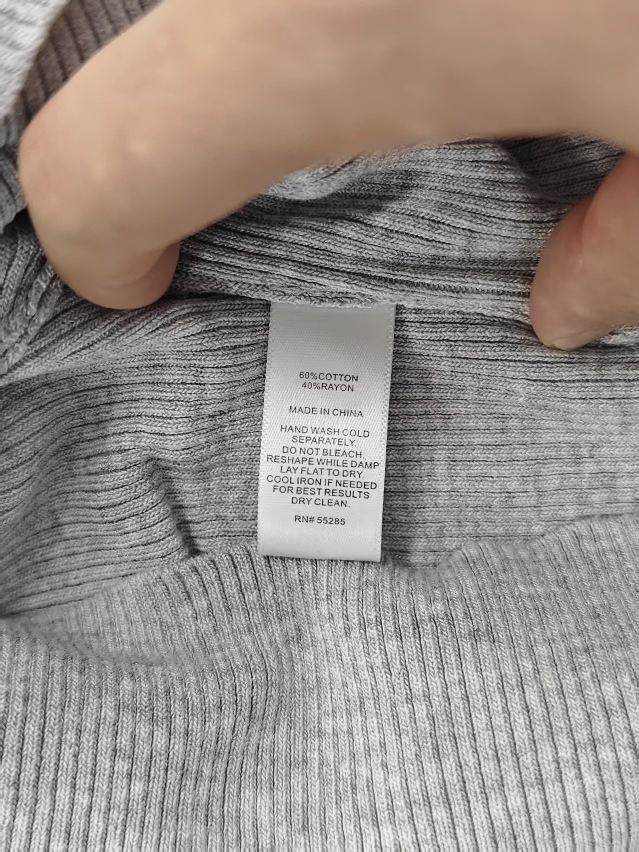 Inner label close-up ladies grey polo knit sweater TF9030