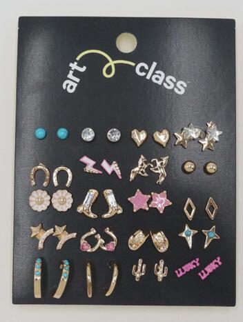 Close up of girl's western cowgirl hat and boot stud earrings TF6685