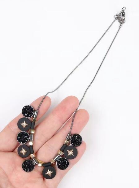 Front detail view of ladies black pendant necklace TR6305