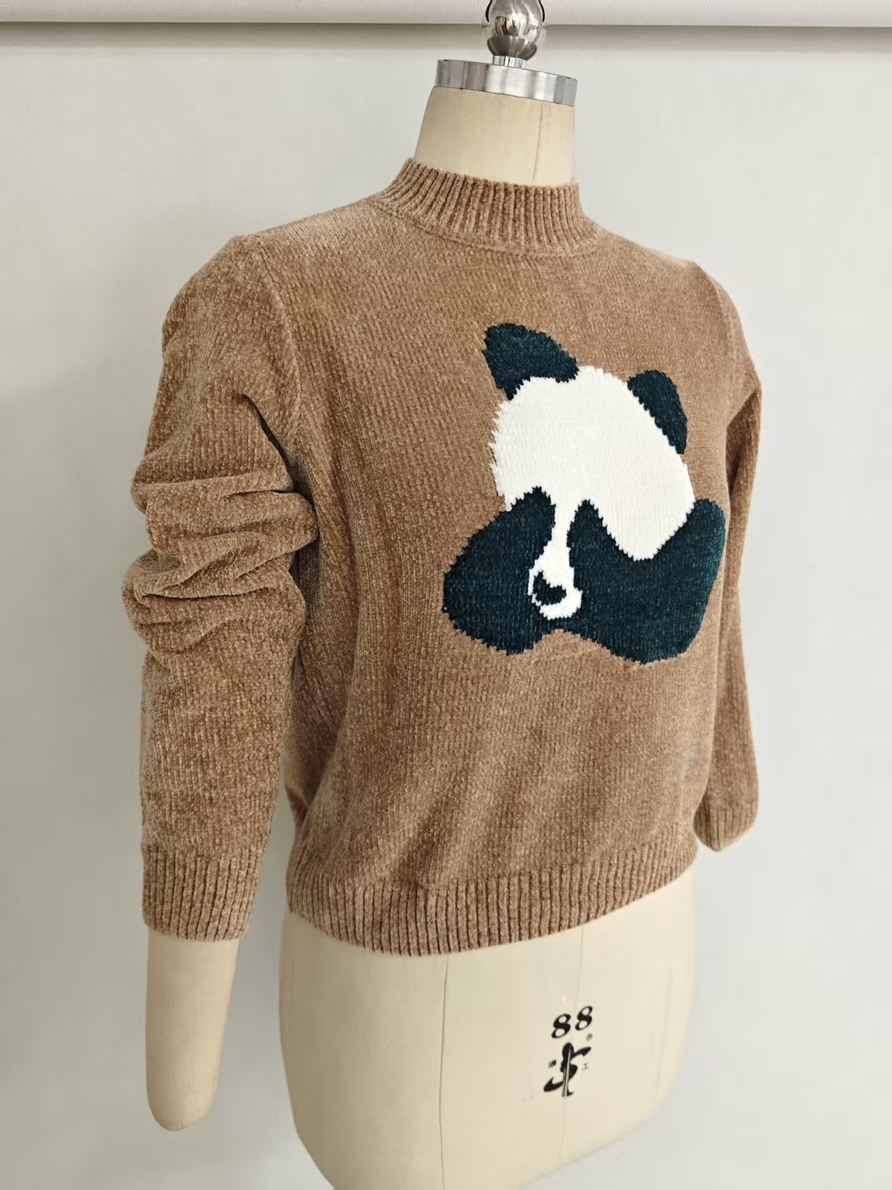 Front view of ladies' graphic knitwear sweater style TF8040
