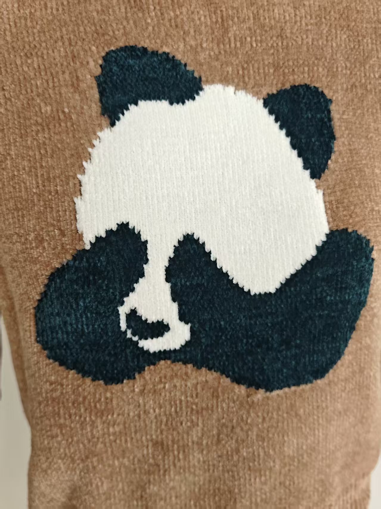 Close up of knit pattern and fabric texture on ladies' sweater TF8040