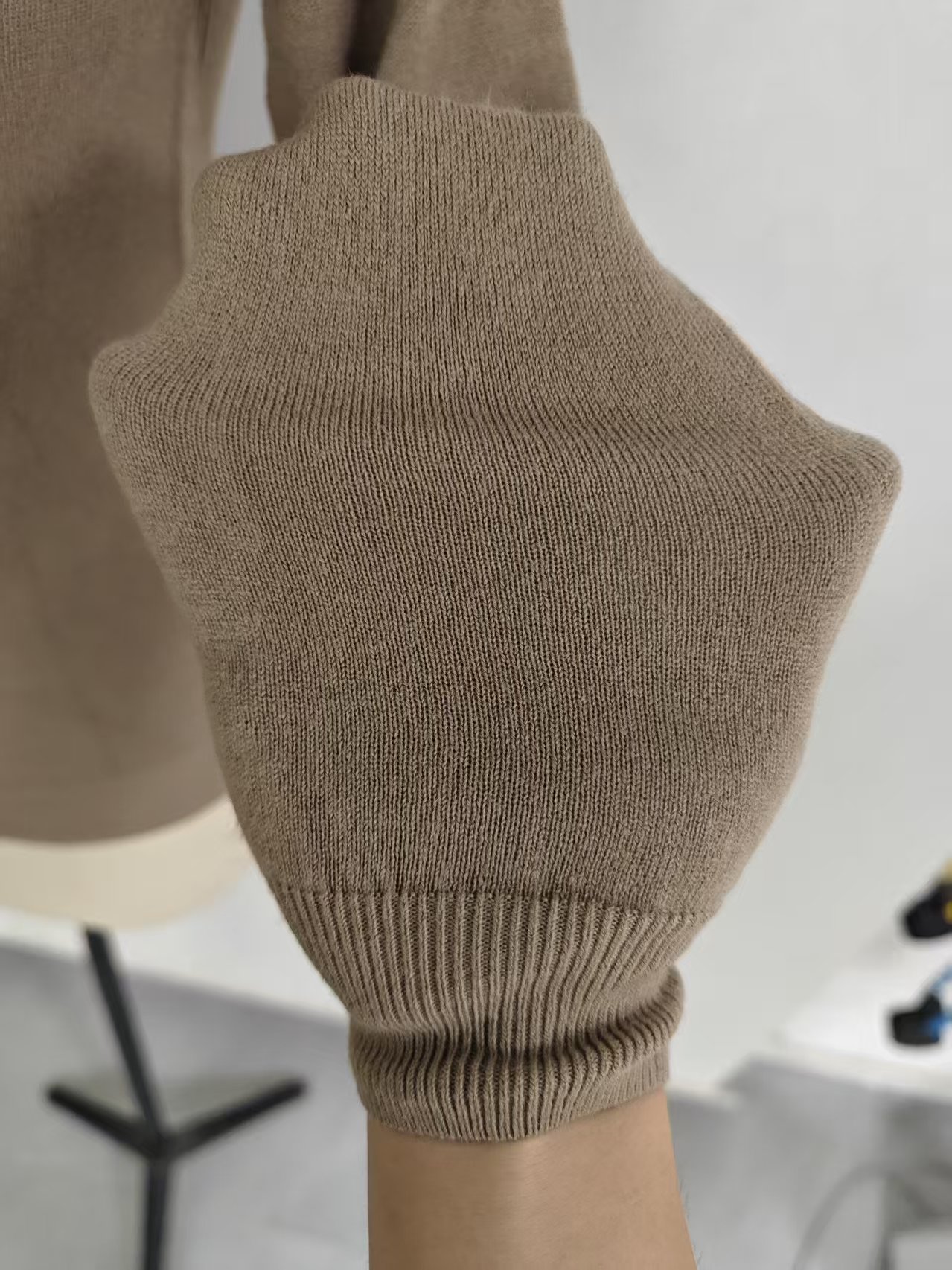Close up of knit fabric texture and neckline on women's cardigan TF8144