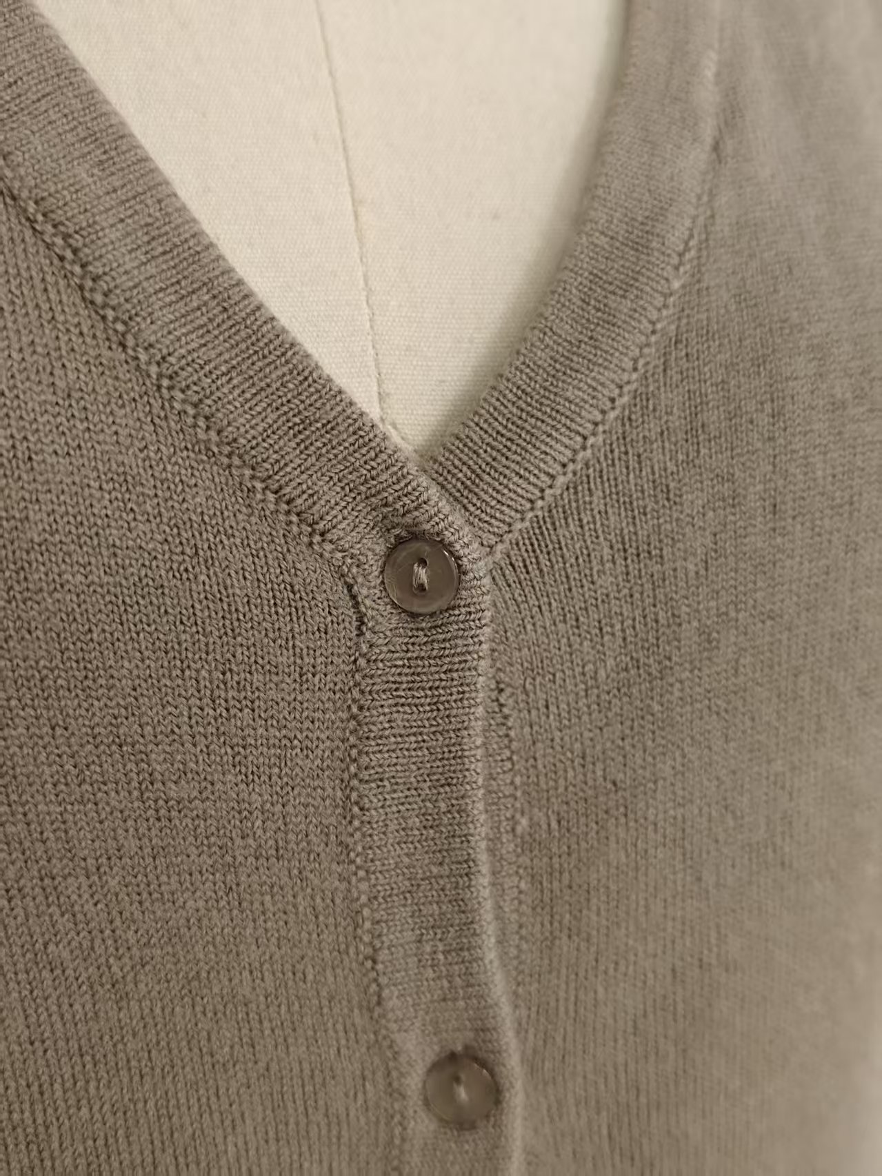 Close up of buttons and placket on ladies' knit cardigan style TF8144