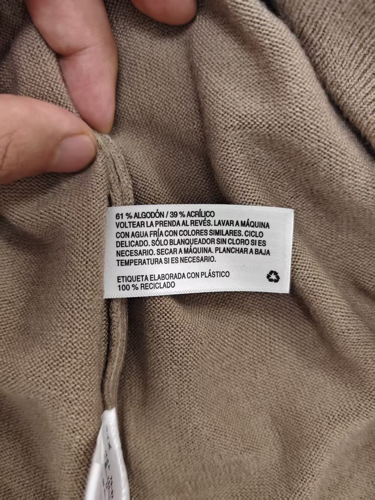 Garment care tag and material composition label on cardigan TF8144