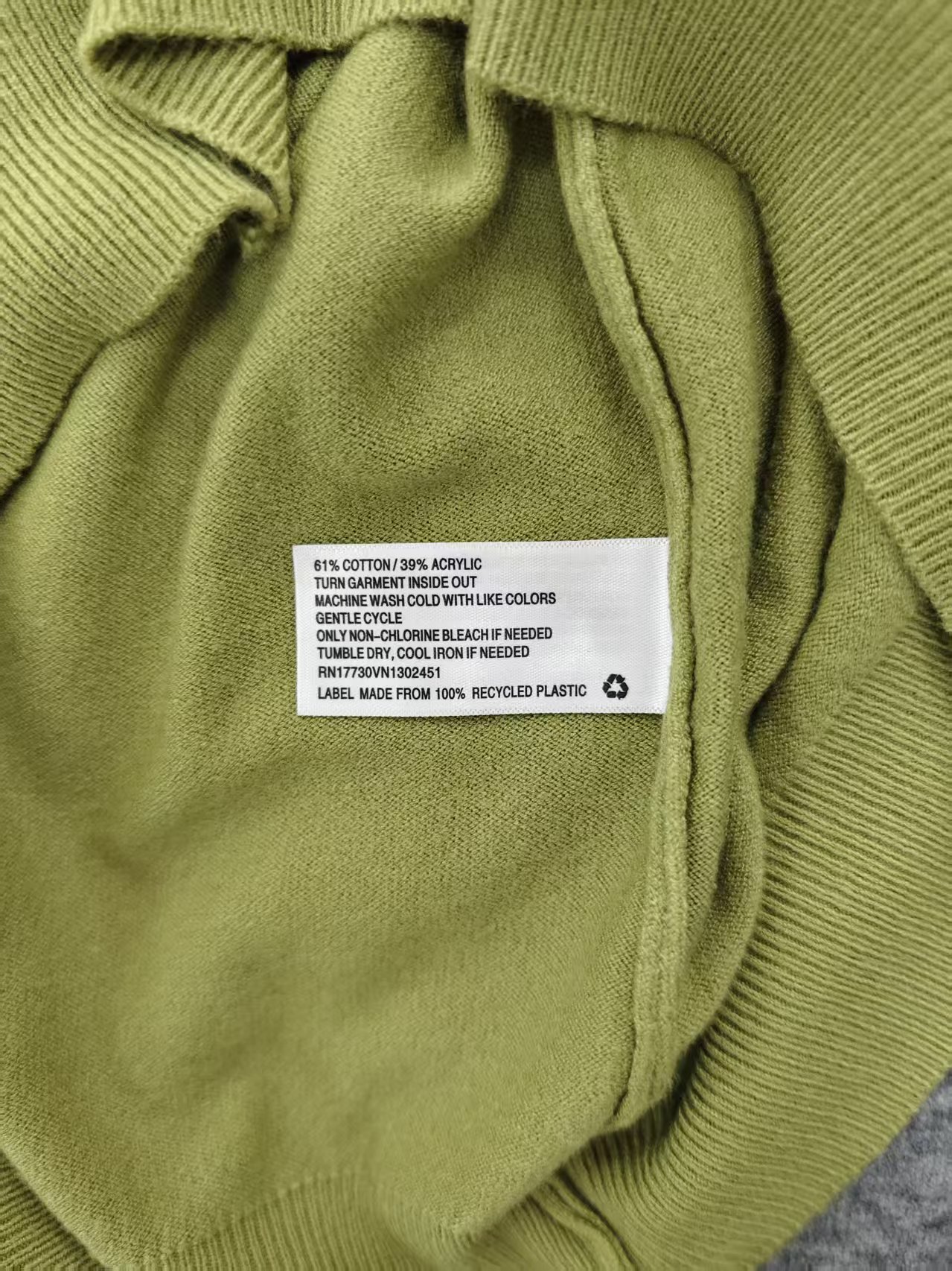 Garment care tag and material composition label on sweater TF8182